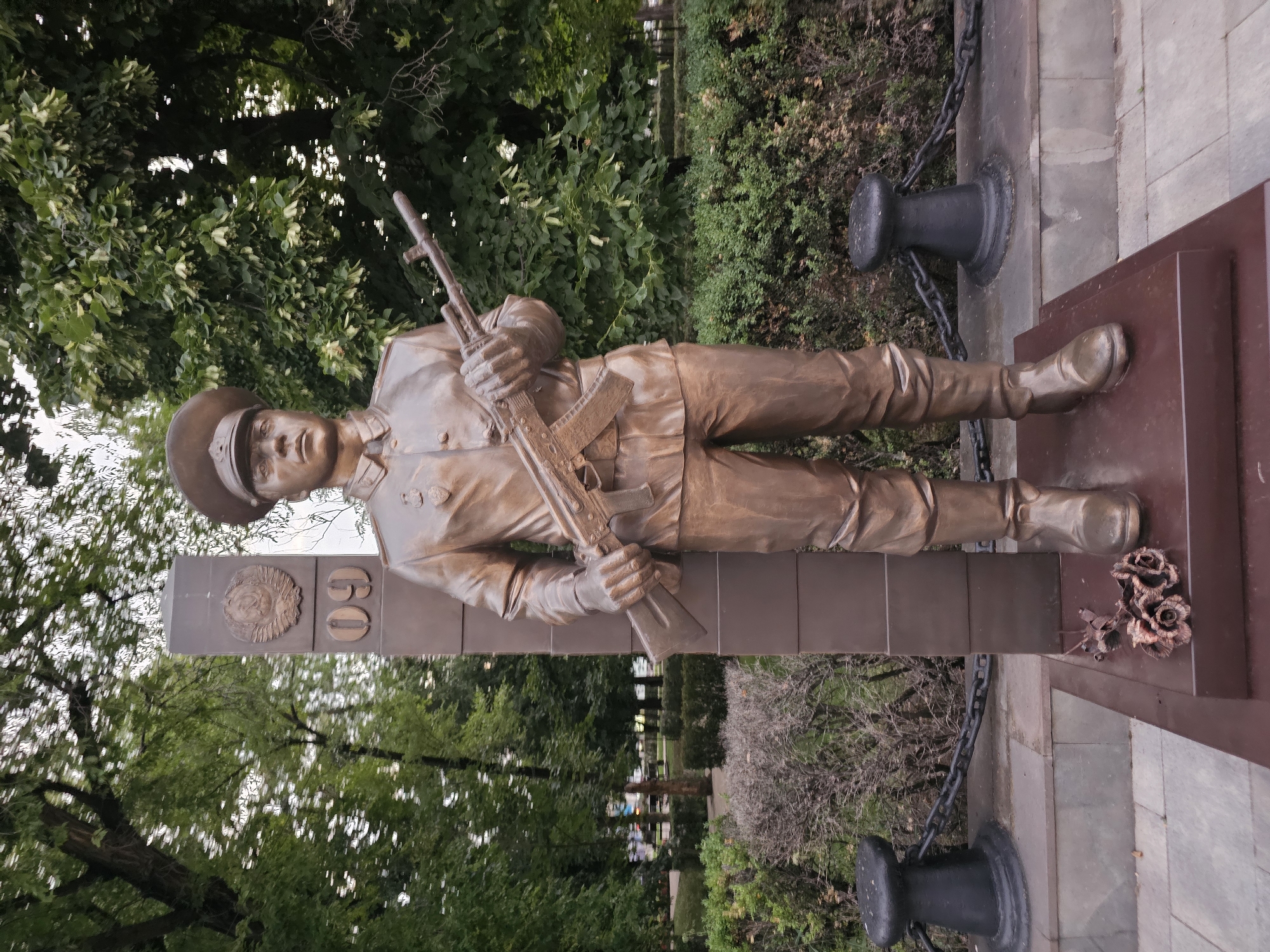 Cherkessk at dusk: memorials, gardens, and a glowing fountain plaza