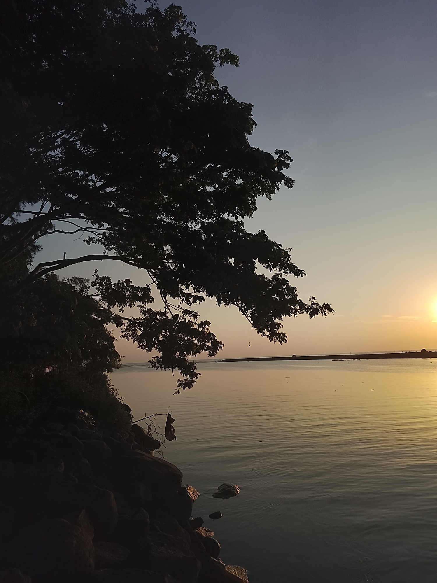 Sunset along the rocky shores and rivers of Reudeuep, Indonesia