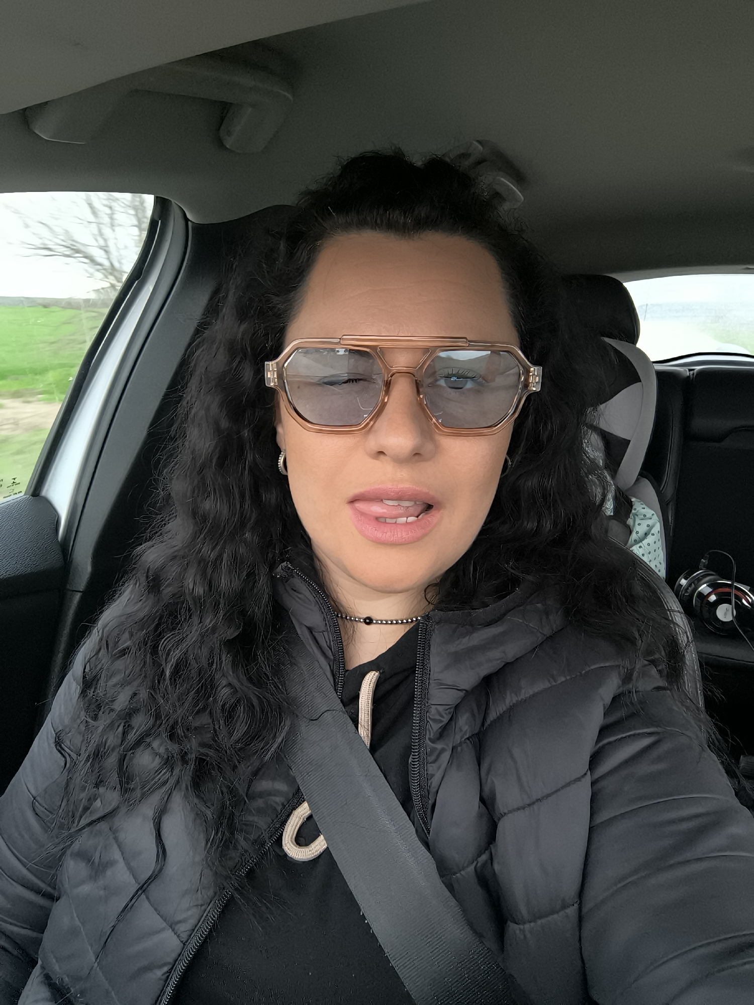 Woman takes playful car selfie in Gulyantsi, Bulgaria