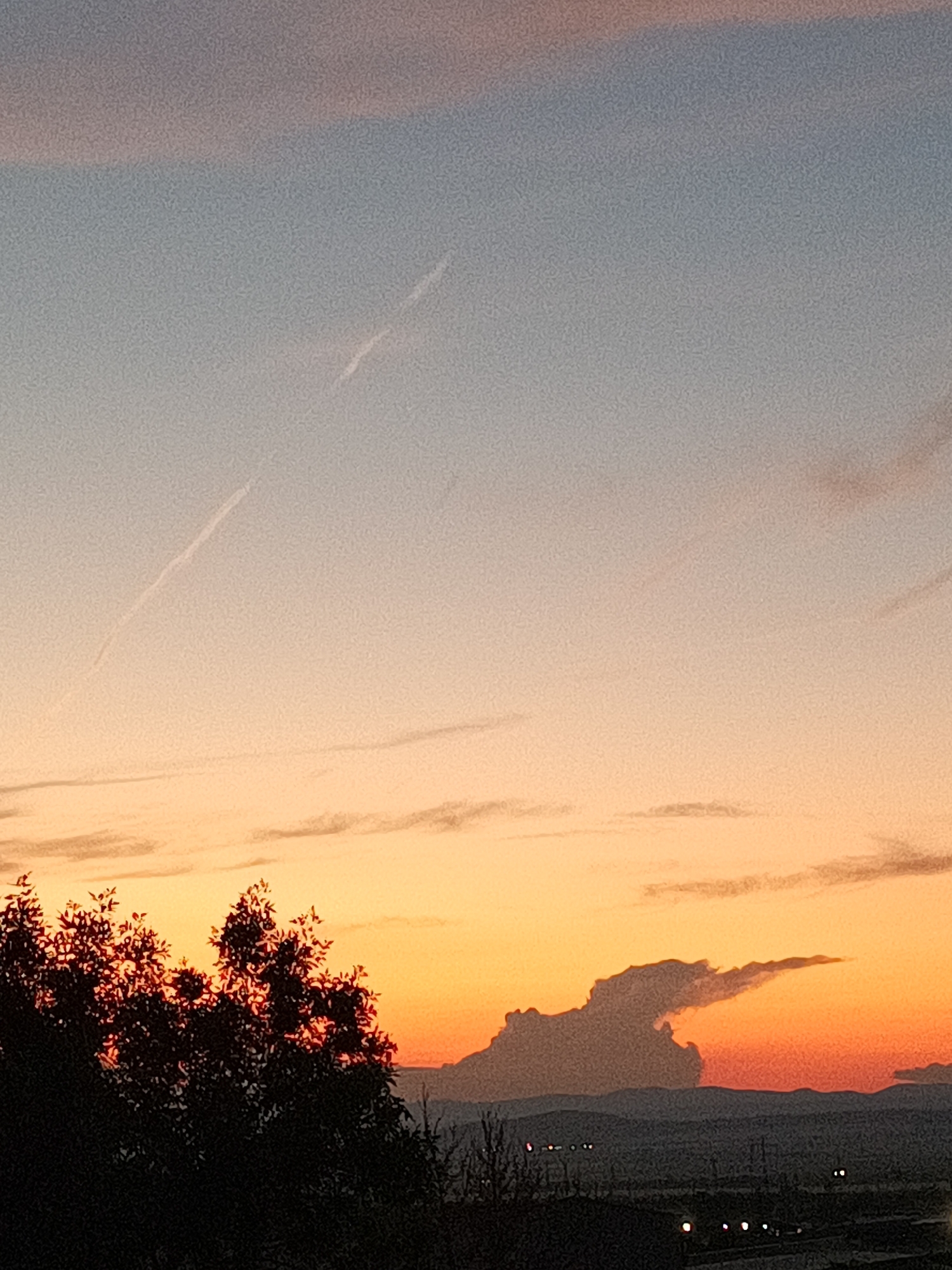 Witnesses document sunset sequence over semi-urban landscape June 8