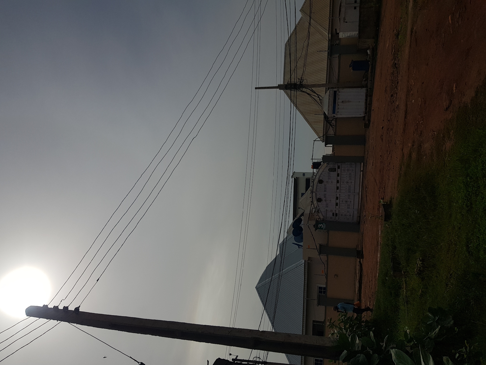 Morning street scenes across two Nigerian neighborhoods after rain