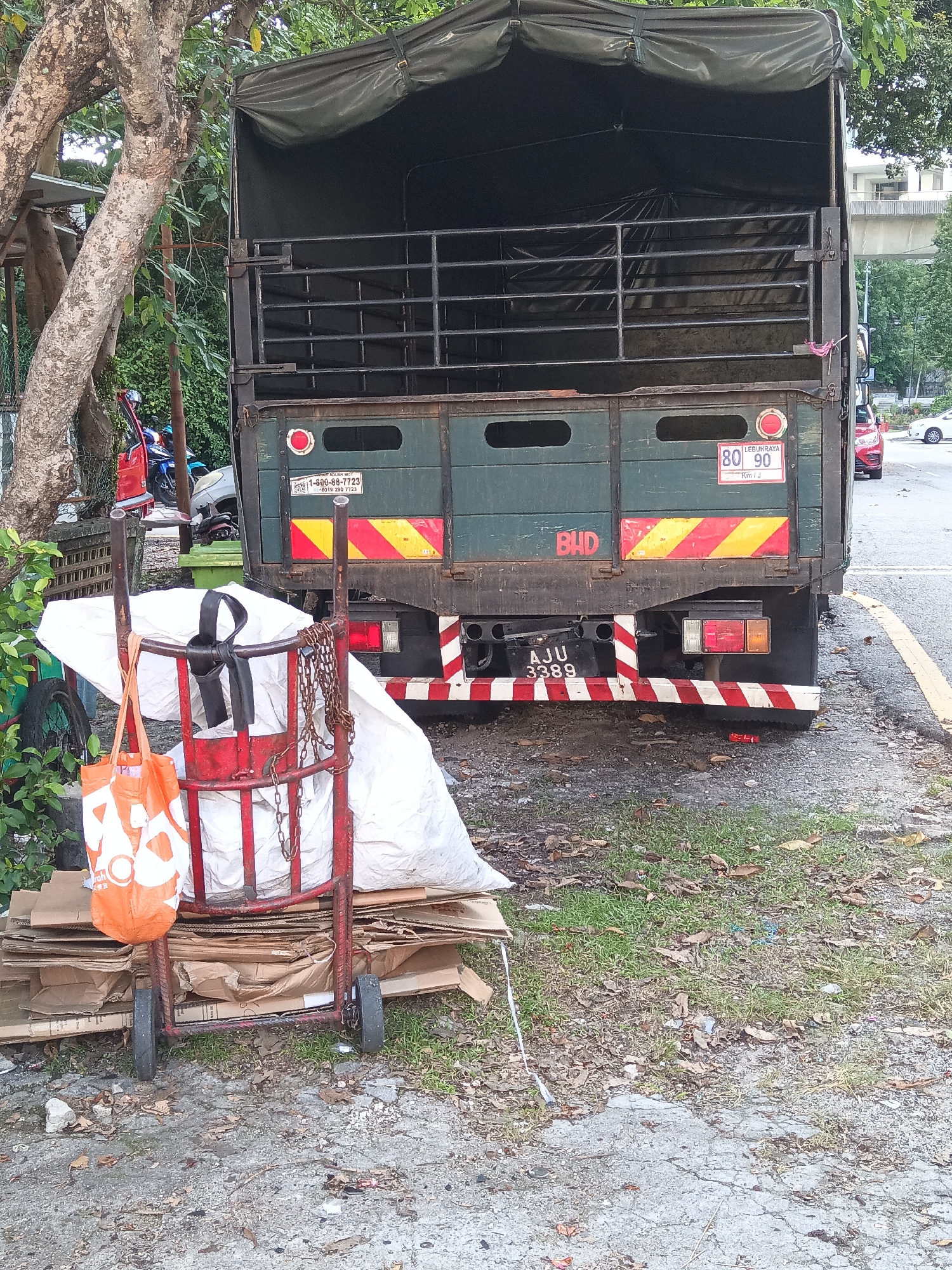 Everyday street life across a dense KL neighborhood