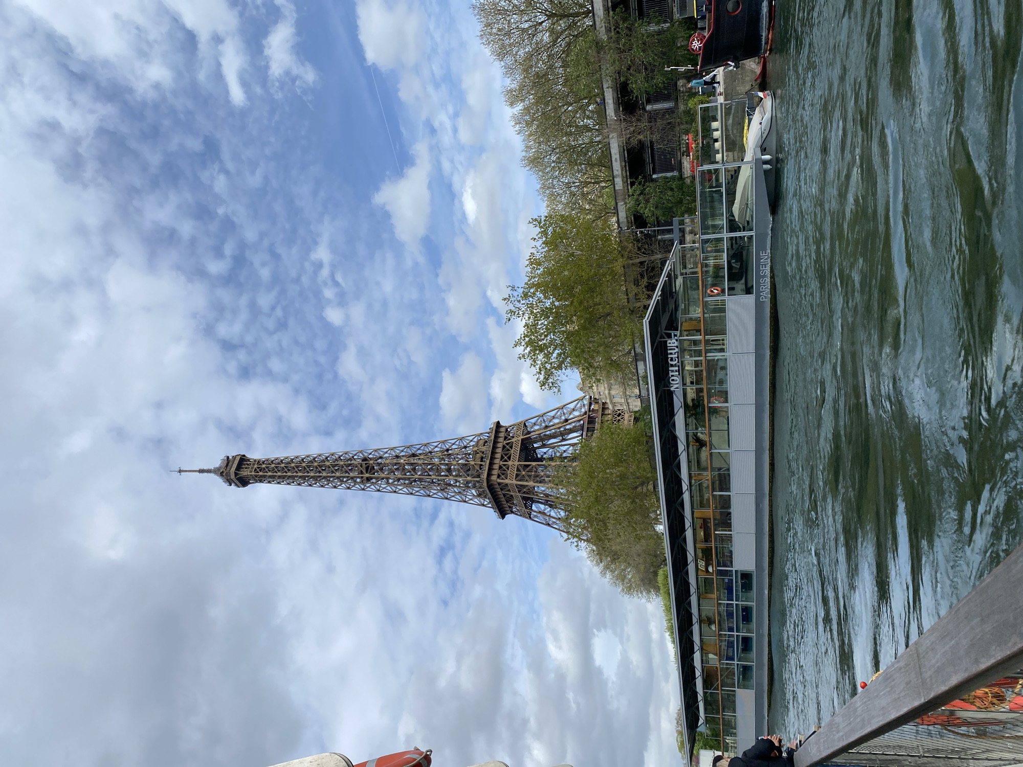 Seine River boat passengers capture Eiffel Tower views