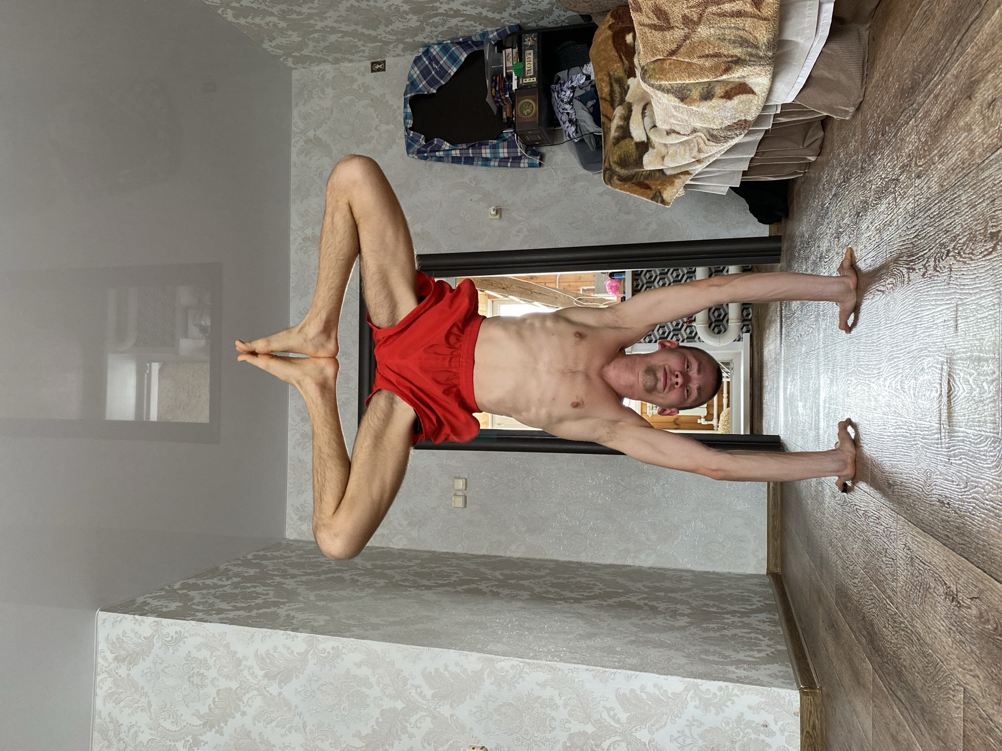 Young man performs indoor handstand in Ulyanovsk, Russia