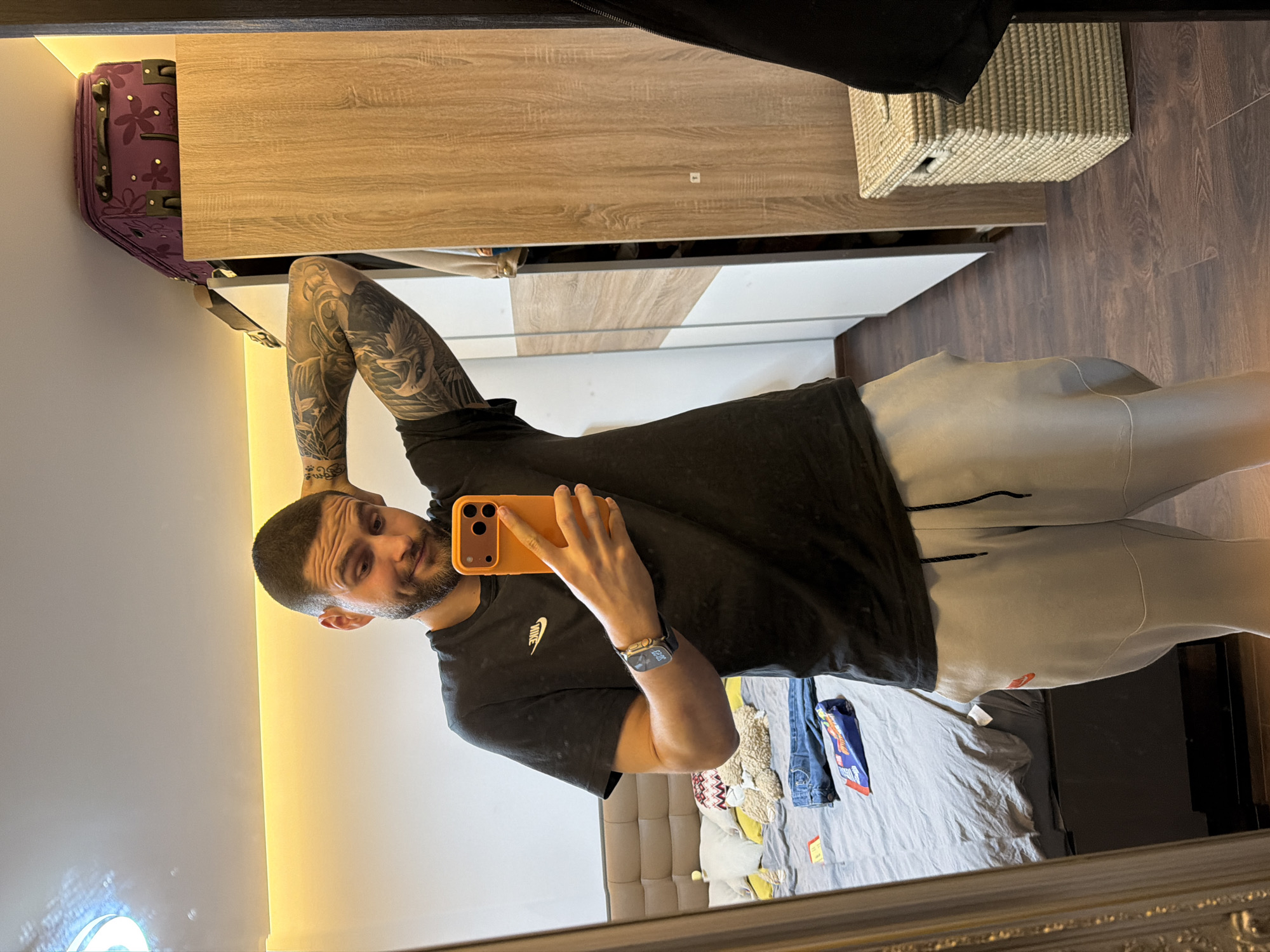 Man takes mirror selfies in athletic wear in Sofia
