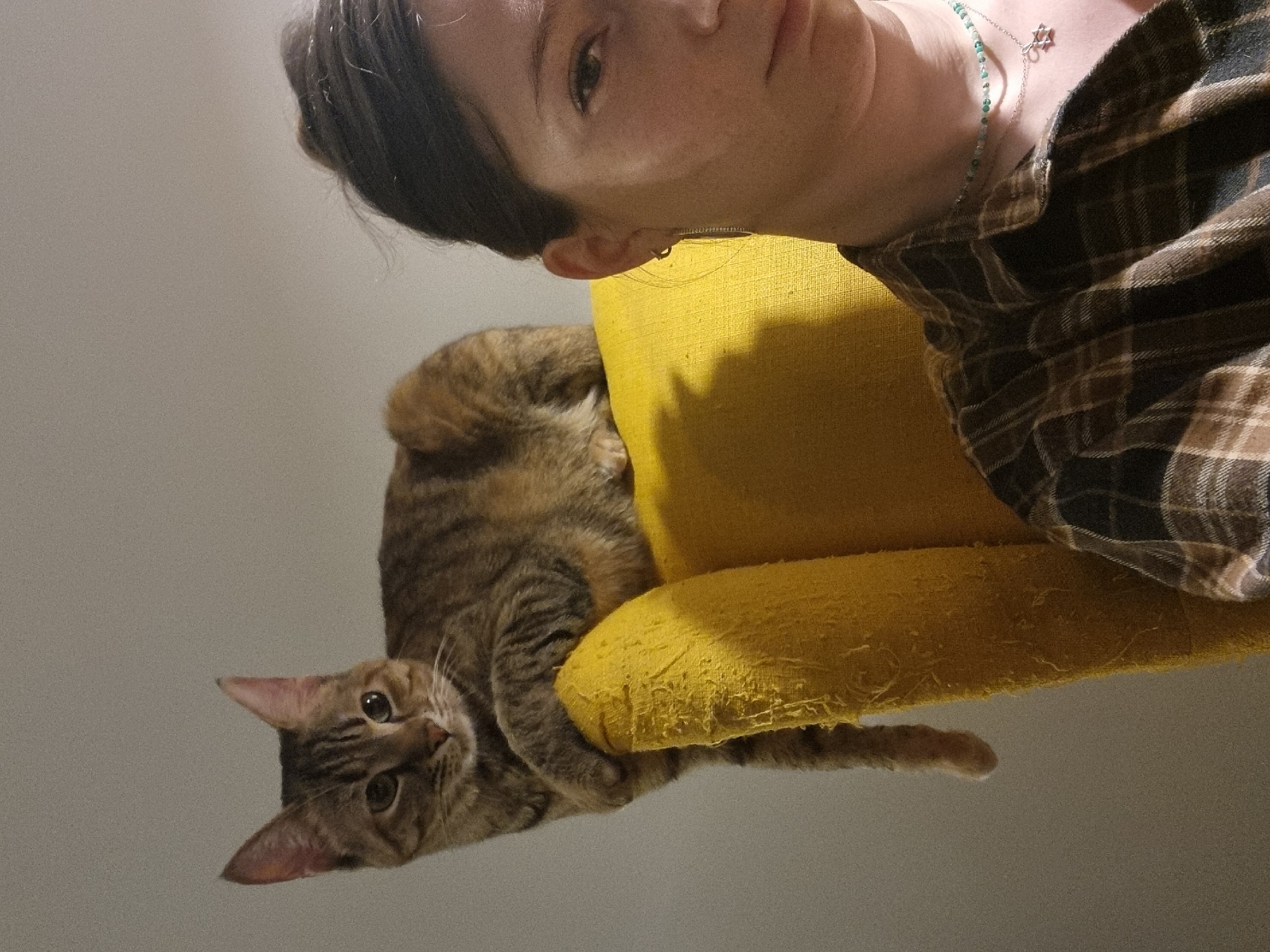 Woman with tabby cat photographed at Ramat Gan residence