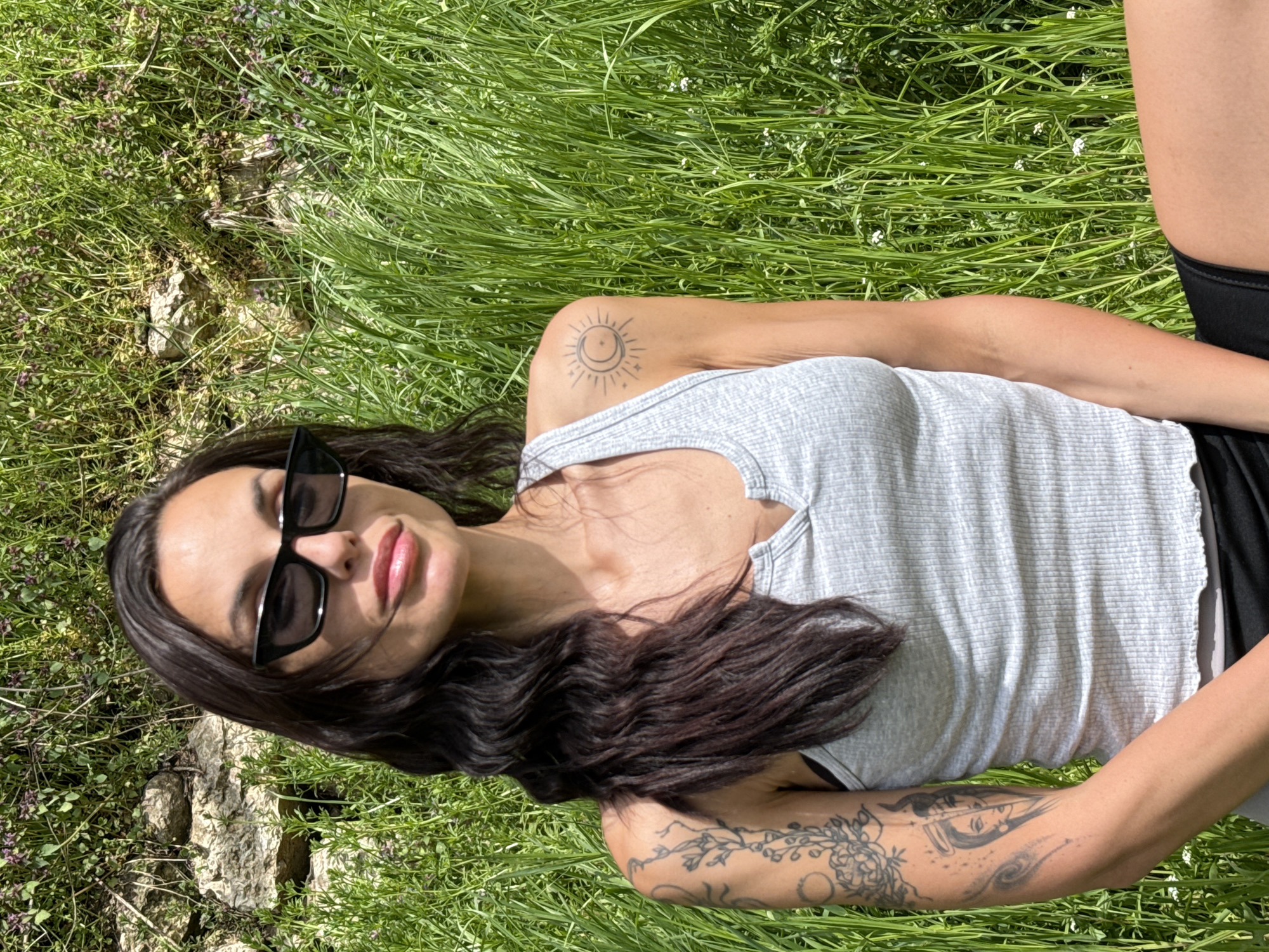 Woman rests in field near Pleven, Bulgaria