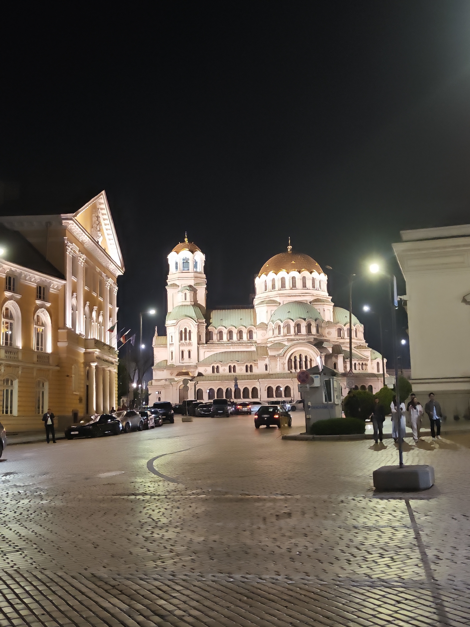 Evening stroll through illuminated Sofia landmarks captured by witness