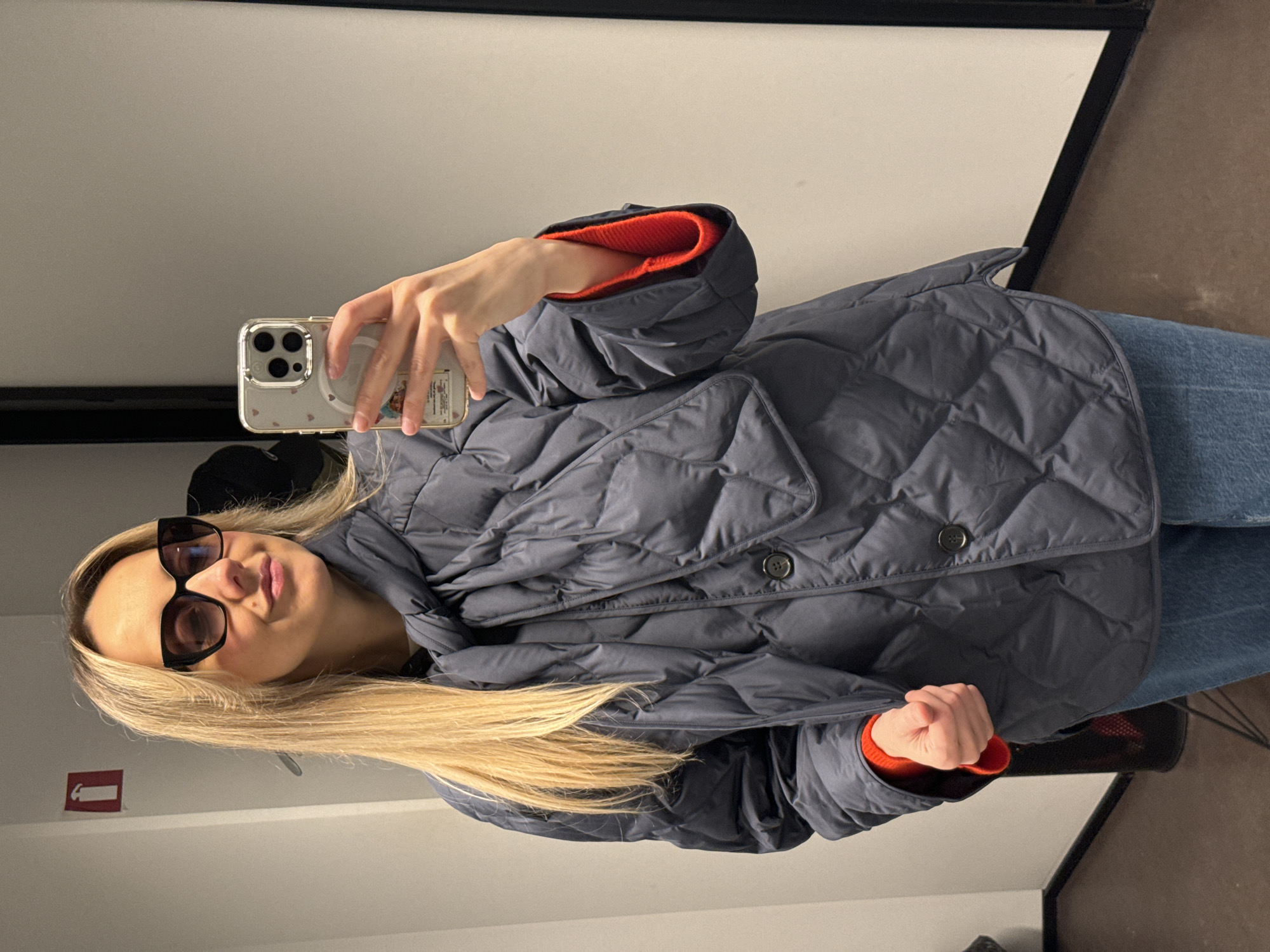 Woman takes selfie in fitting room in Riga