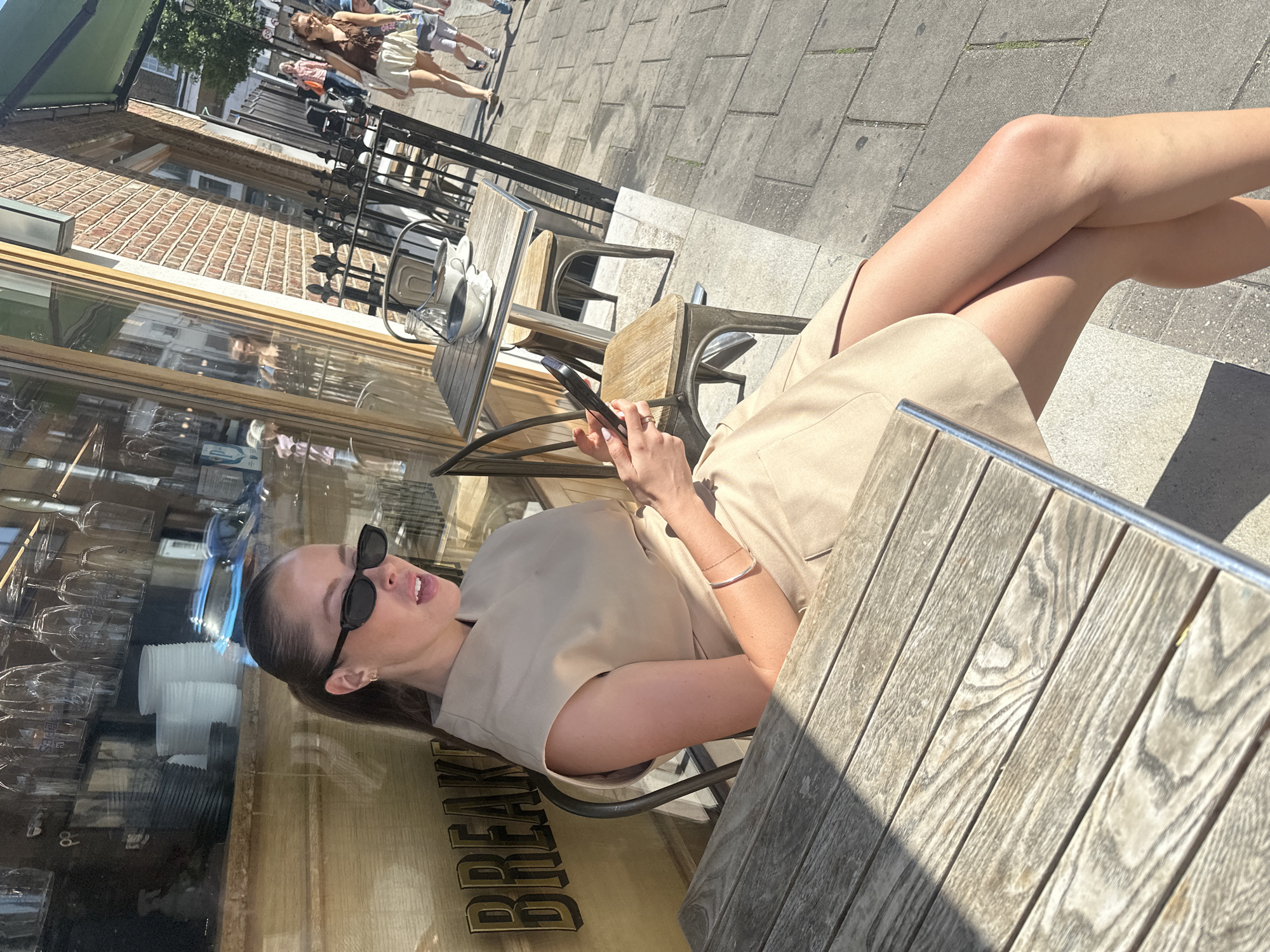 Cafe patrons captured in casual moments during morning hours