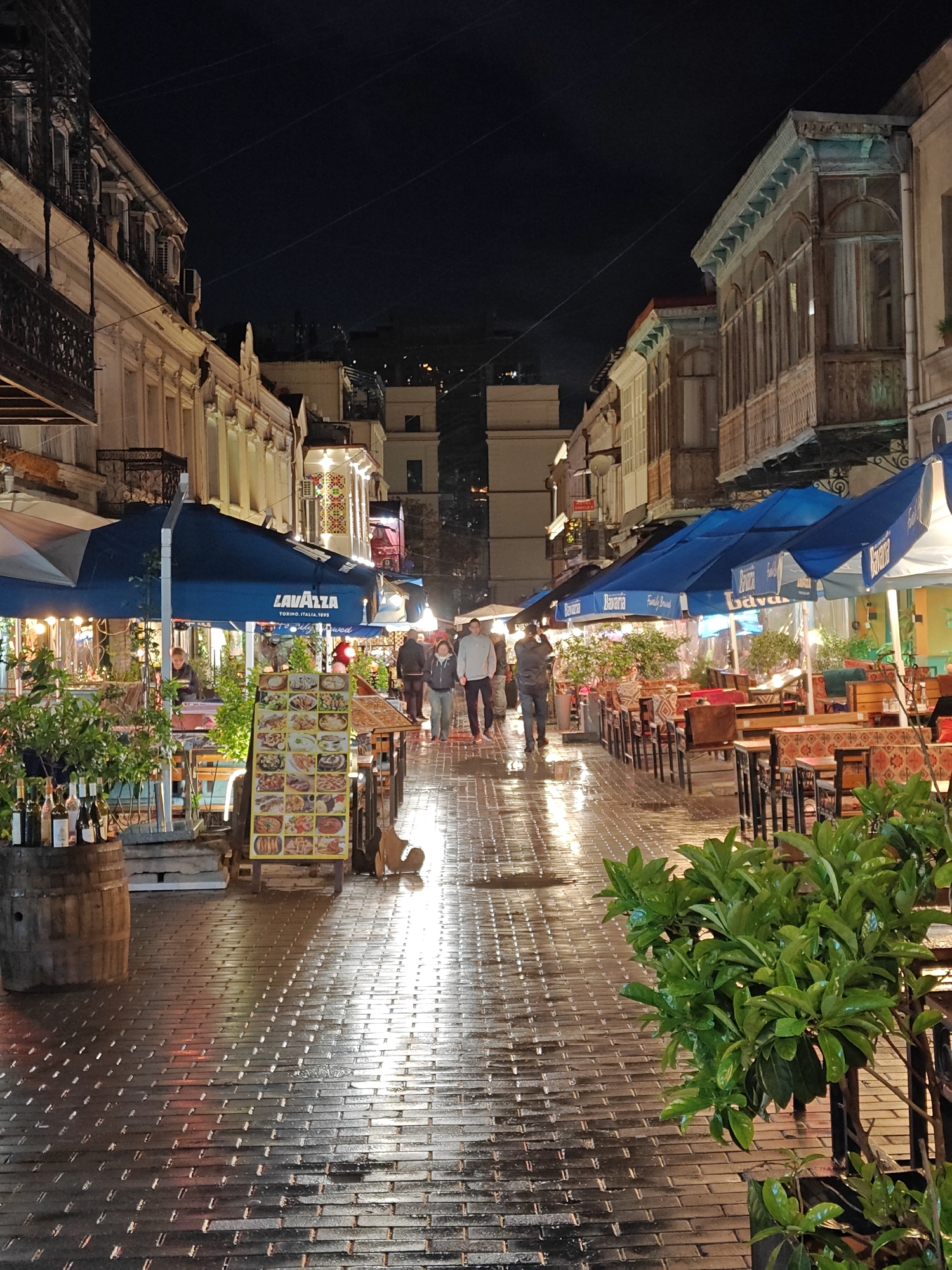 Evening stroll captures illuminated Tbilisi streets after rain