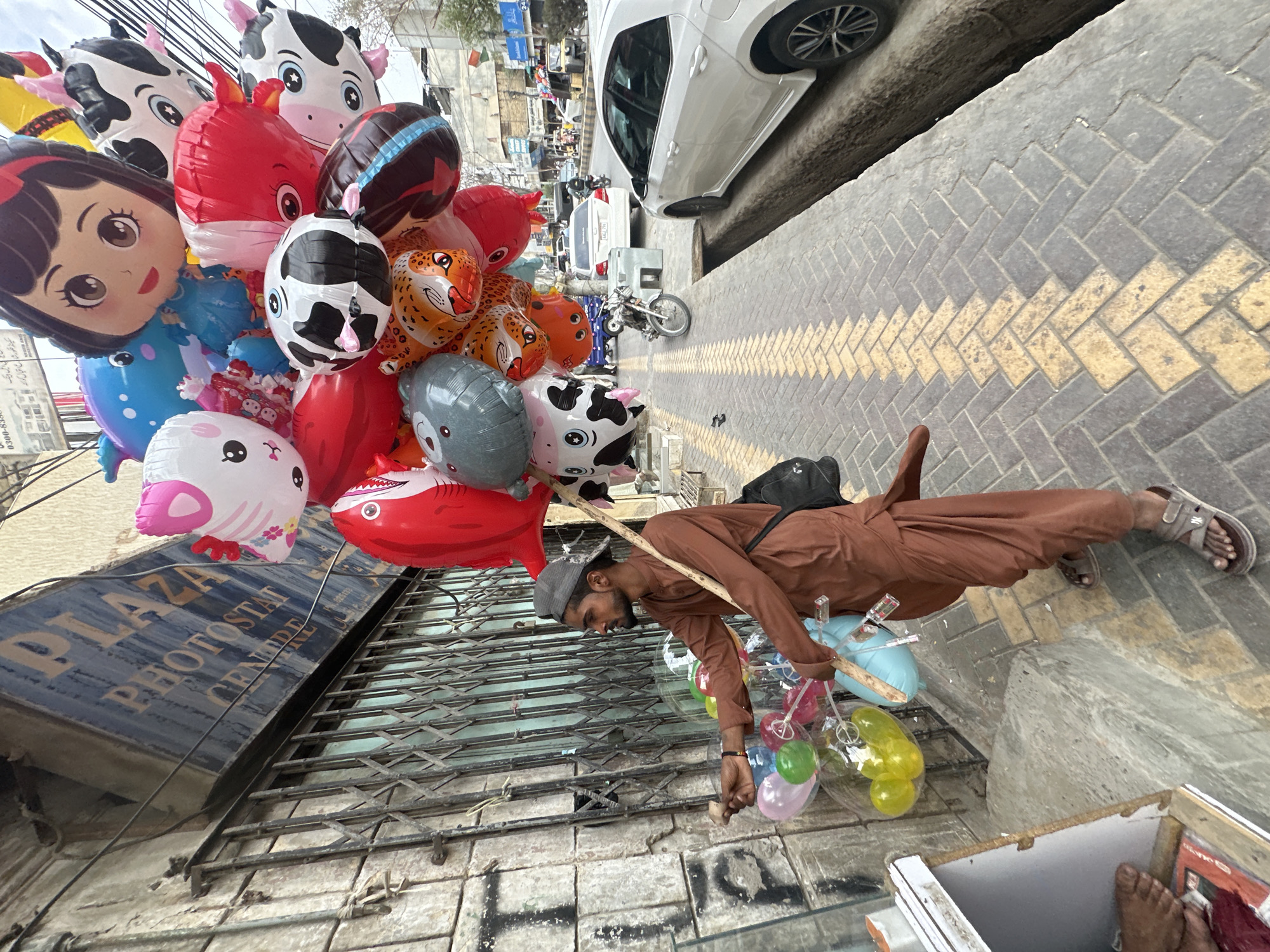Balloon vendor selling colorful balloons on the streets of Quetta