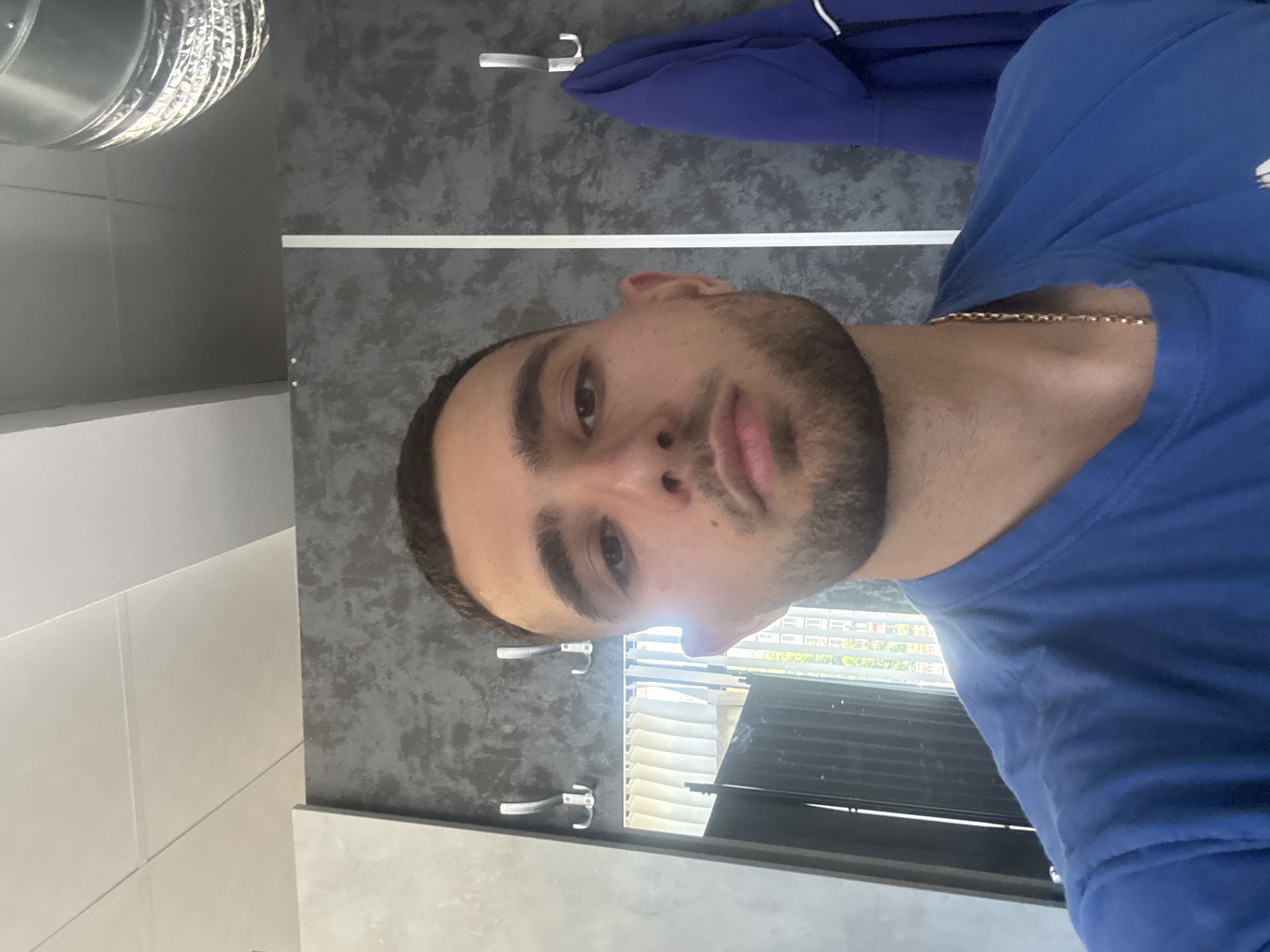 Young man documents selfie session in Gabrovo, Bulgaria
