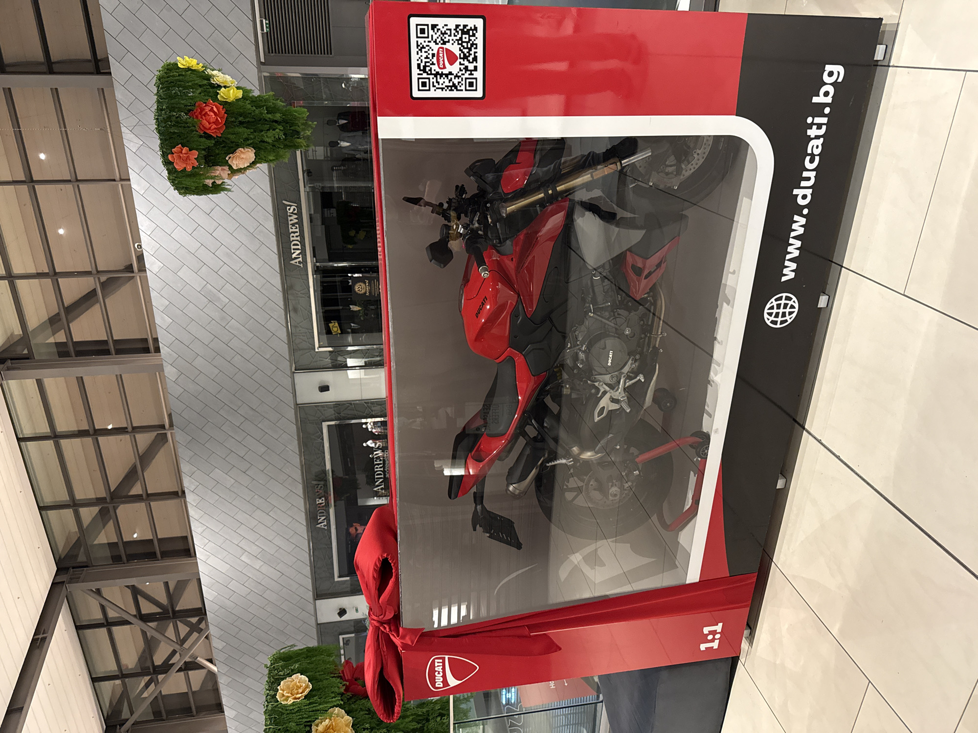 Ducati motorcycle showcased in glass display at Sofia mall