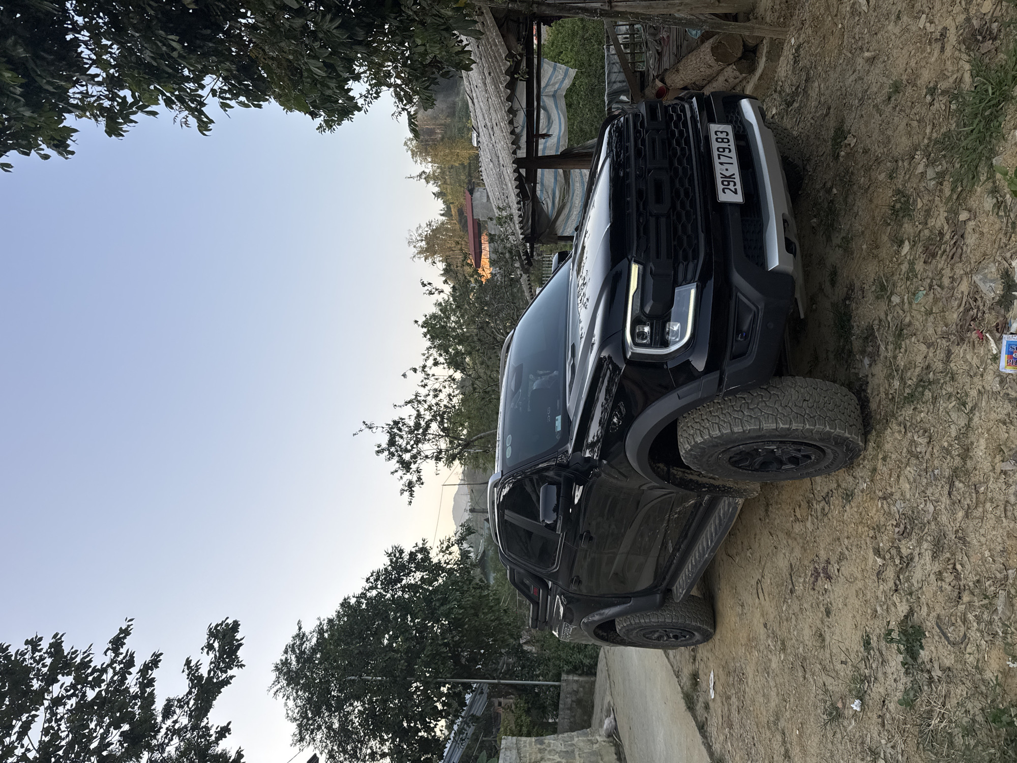 Black pickup truck parked in rural Bắc Hà Vietnam