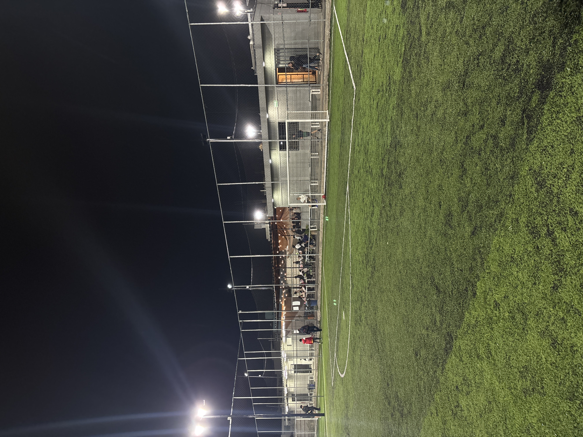 Late-night pizza and illuminated soccer field documented in Mexico