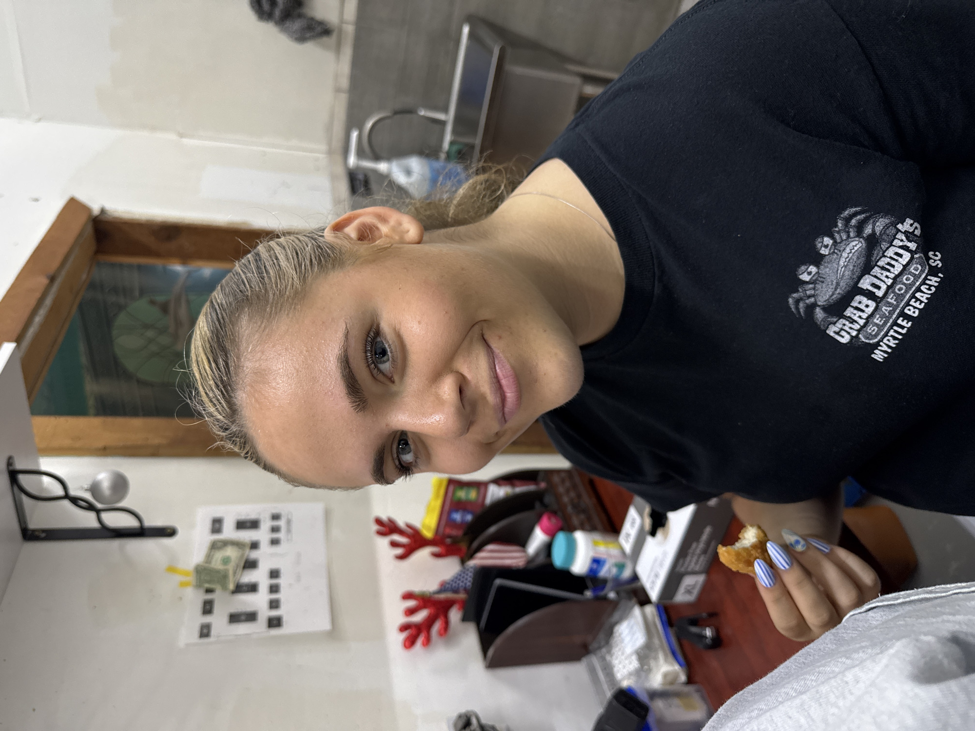 Woman dines at shark-themed seafood restaurant in Garden City Beach
