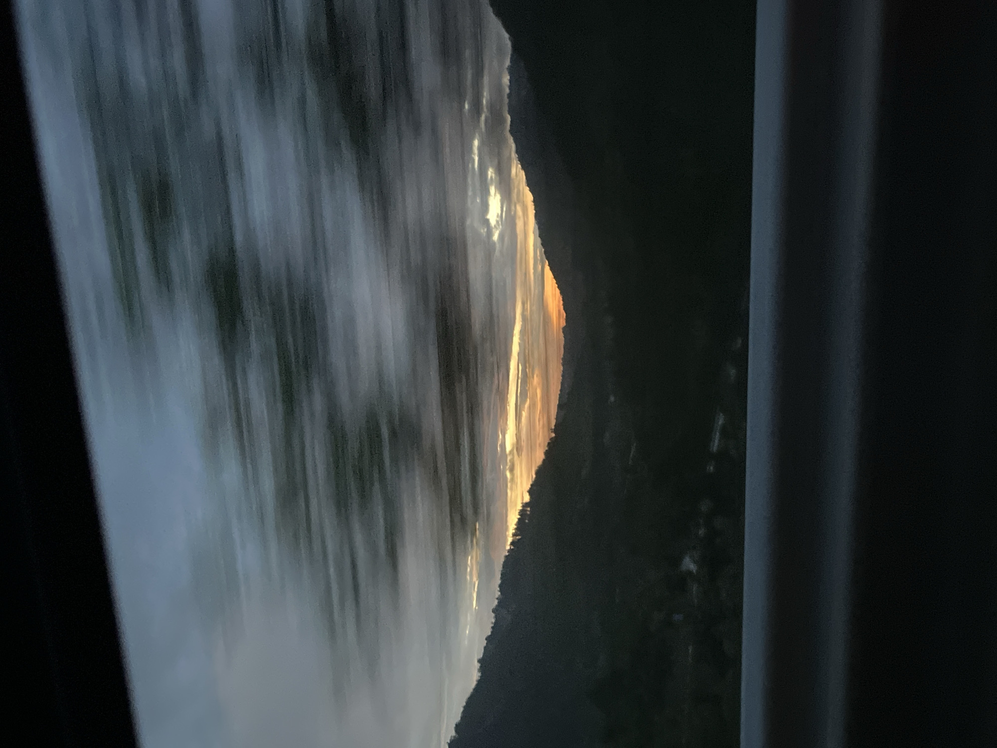 Dramatic sunset captured over Bulgarian mountains from moving vehicle