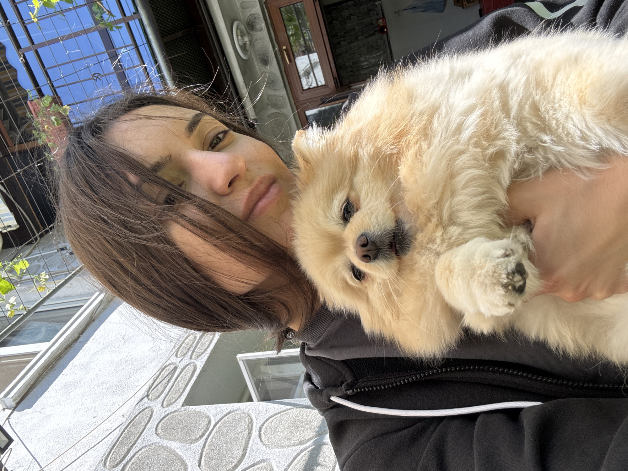 Woman with dog photographed in Razlog, Bulgaria