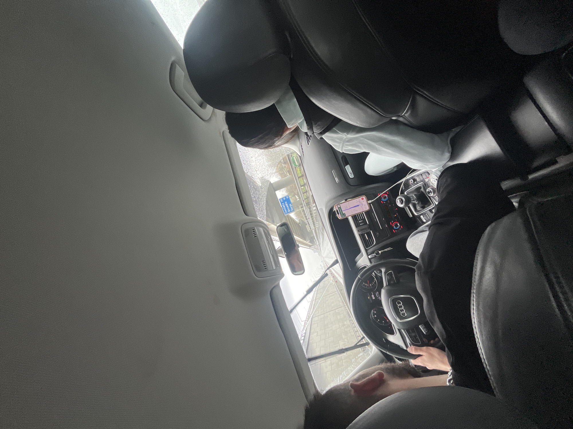 Driver navigates rainy streets in Bucharest
