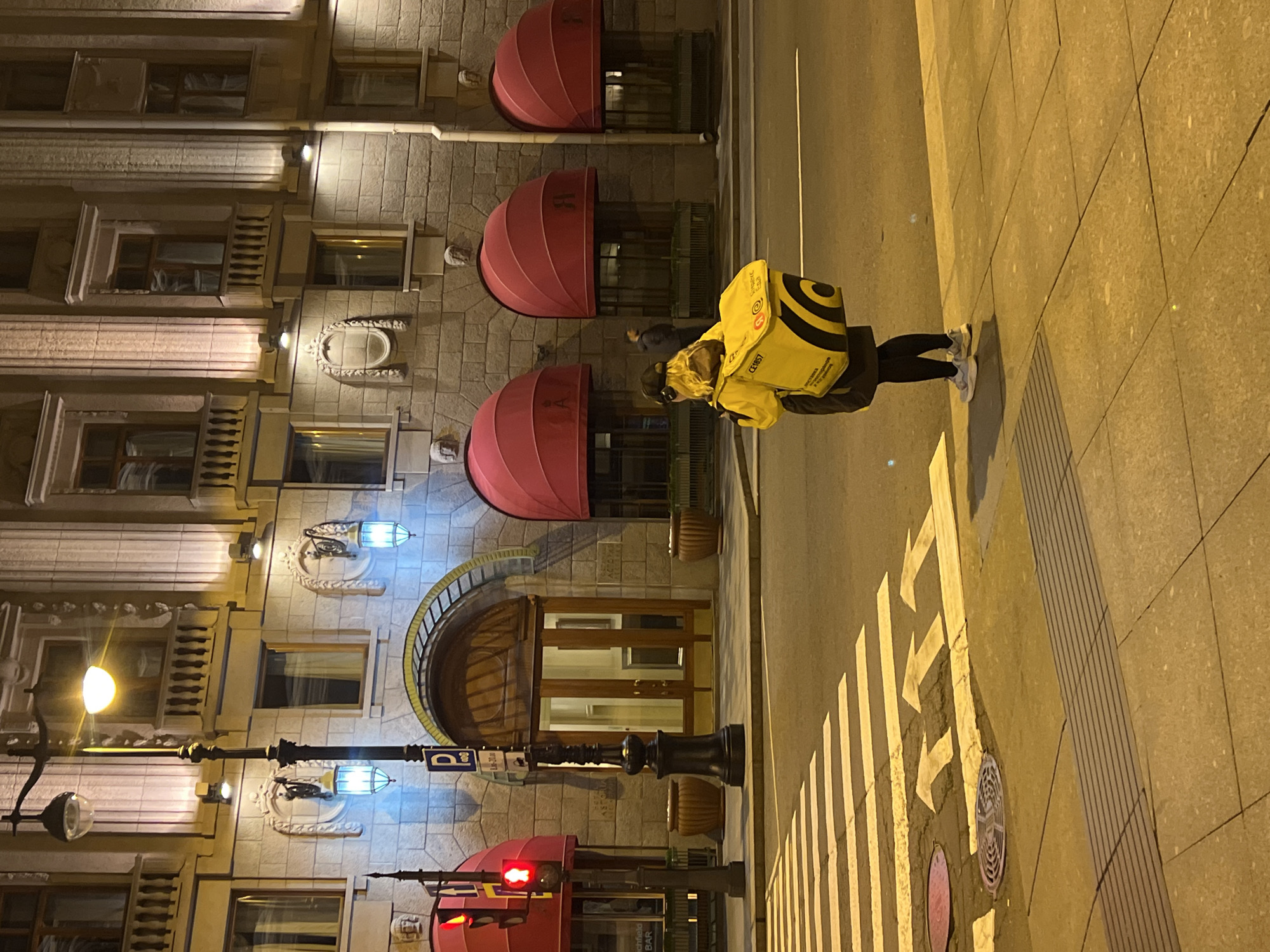 Delivery worker makes evening rounds in Saint Petersburg