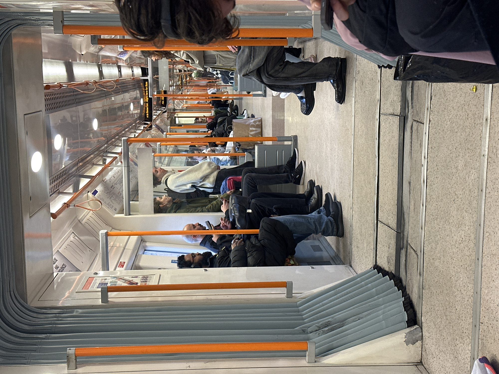 Evening commuters travel on London Underground train carriage