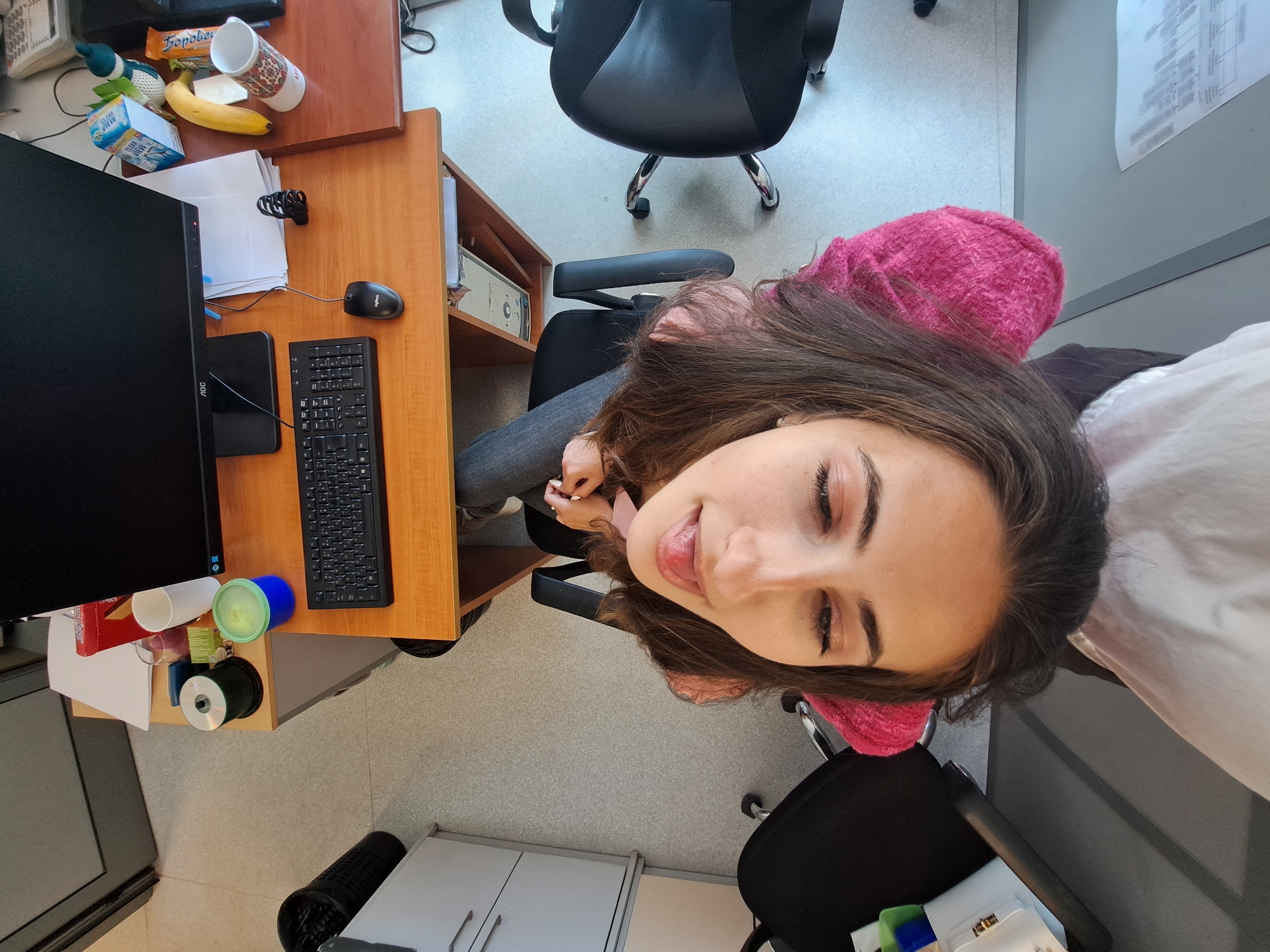 Young women photographed in casual office setting during morning hours
