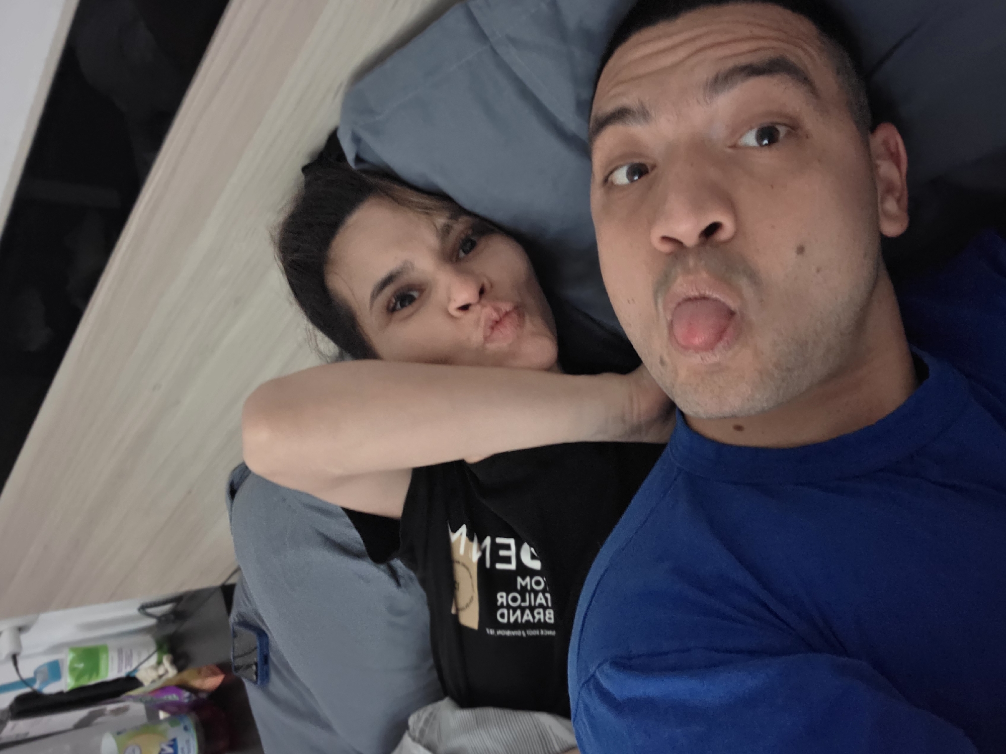 Couple poses together indoors in Veliko Tarnovo bedroom