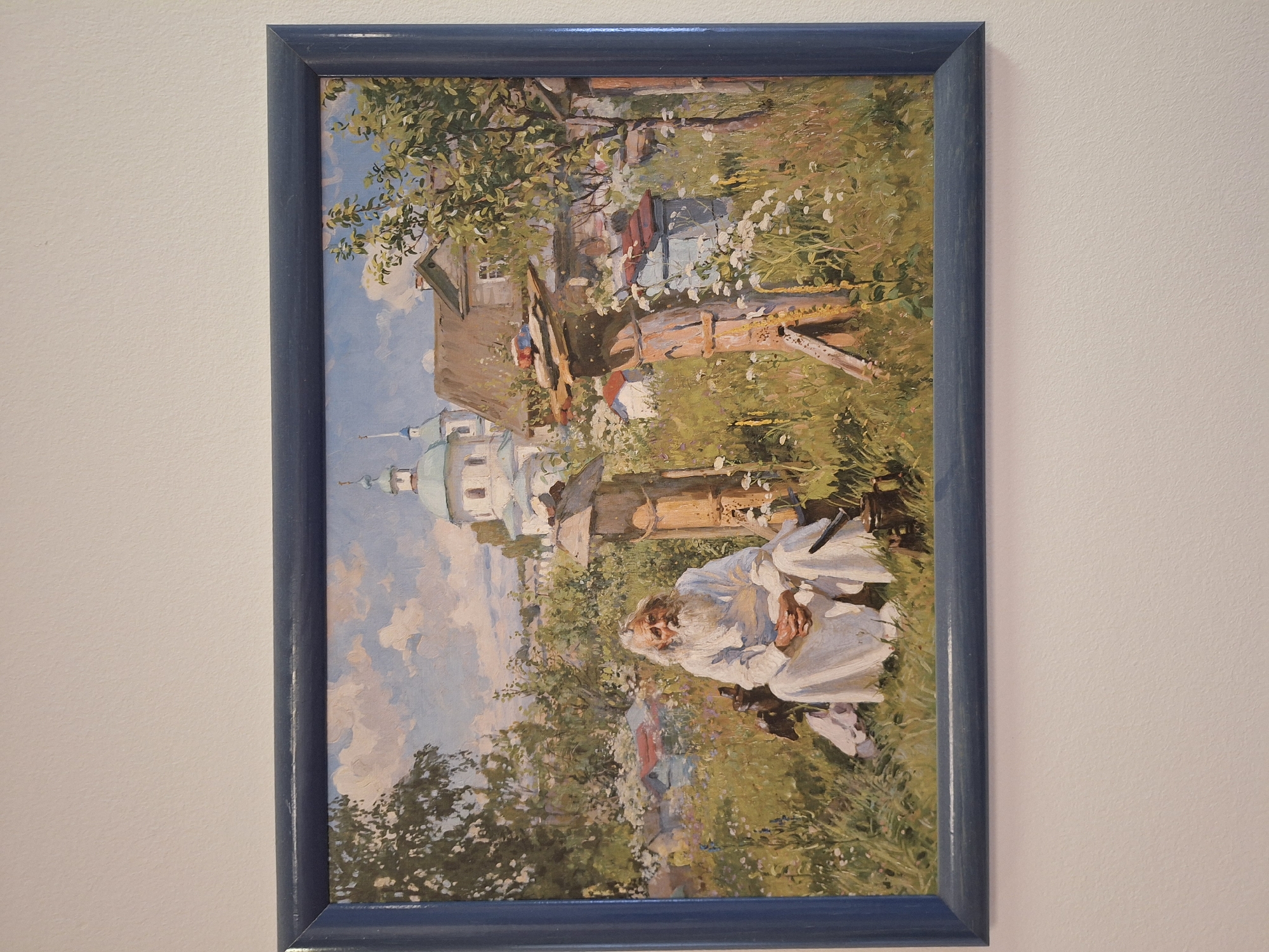 Two paintings displayed in Moscow featuring rural and winter scenes