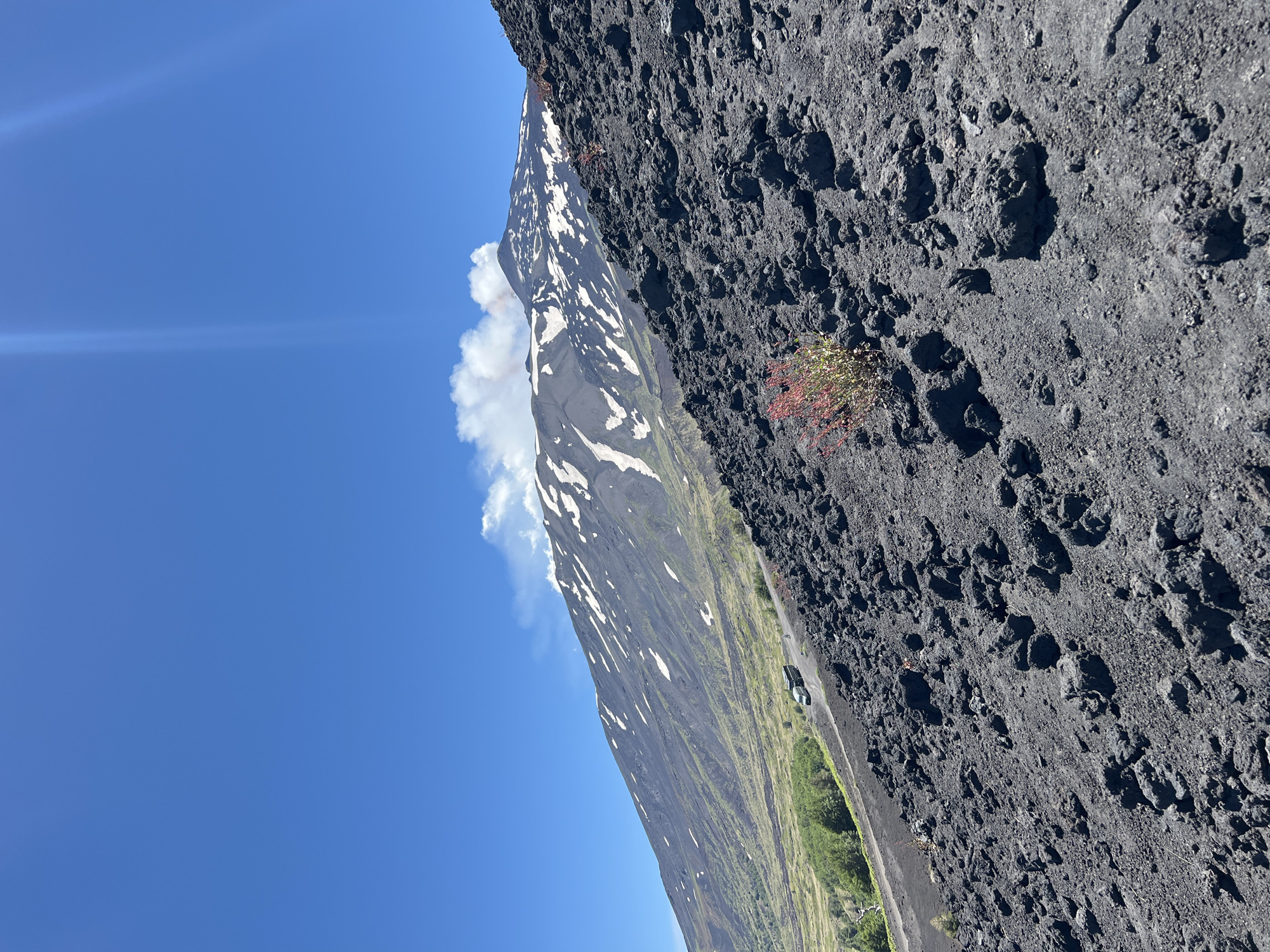 Hikers explore Mount Etna's active volcanic landscape in Sicily