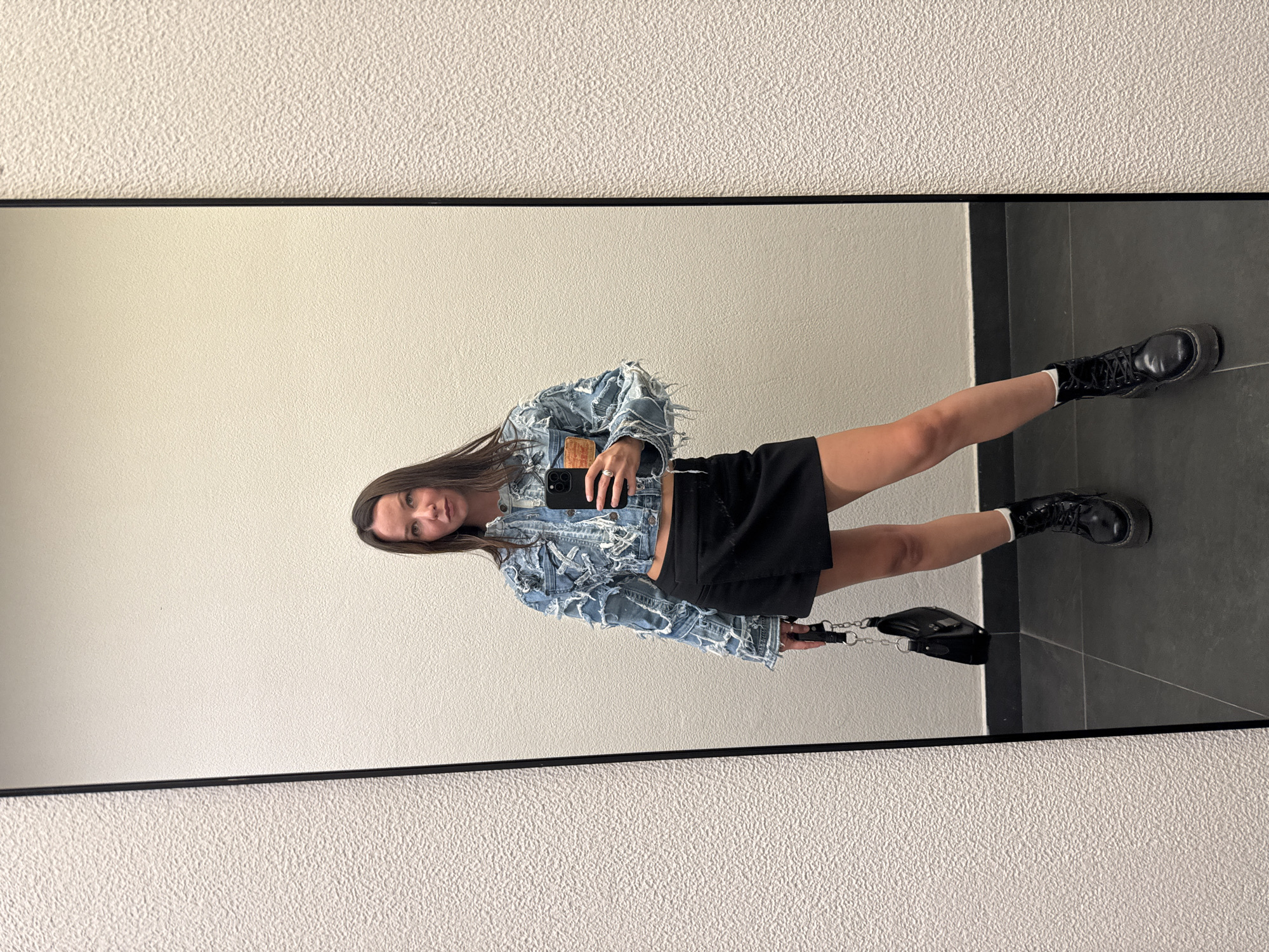 Mirror selfies in a Moscow elevator, denim-and-boots outfit