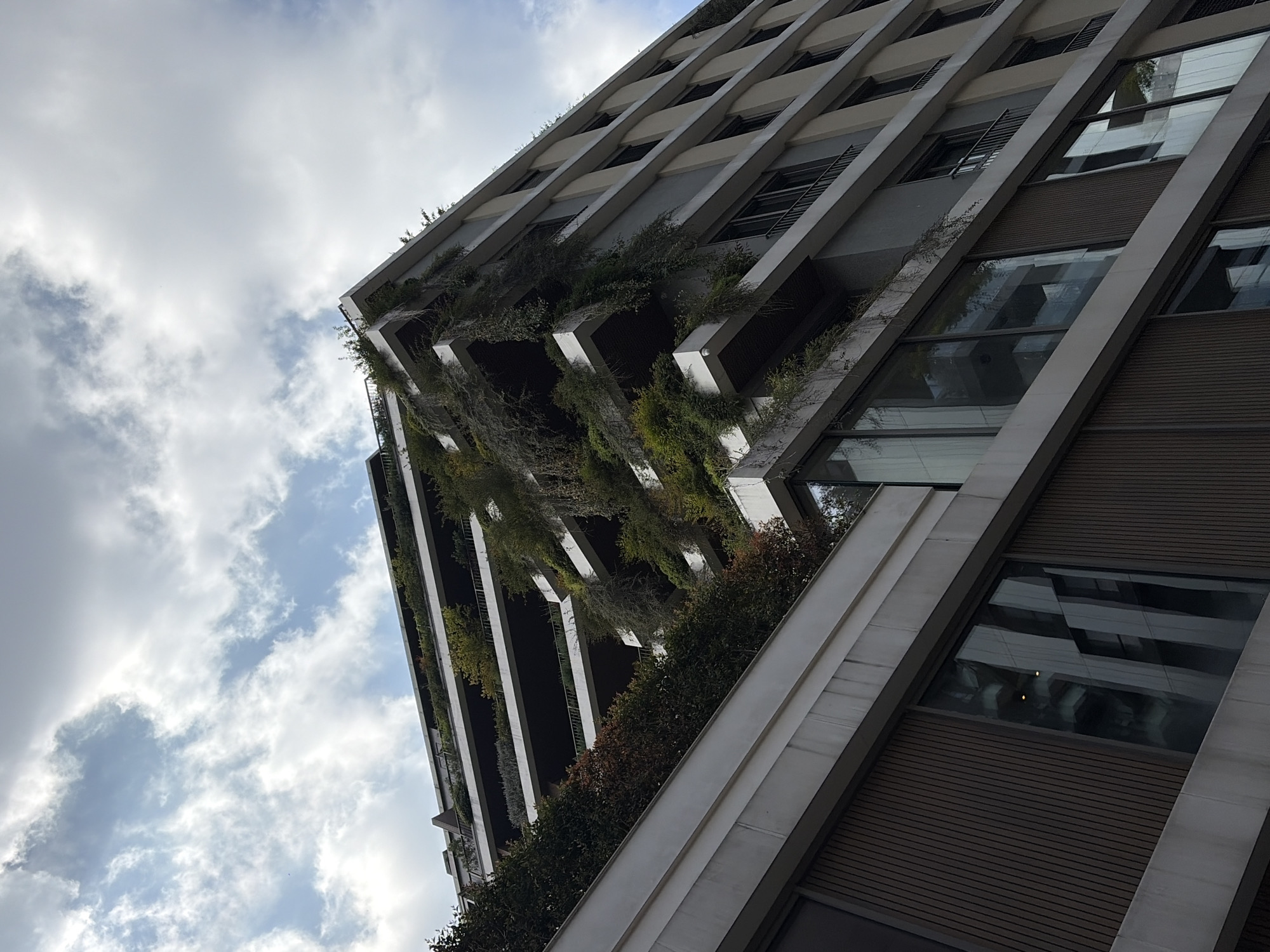 Modern building with vertical gardens observed in Milan
