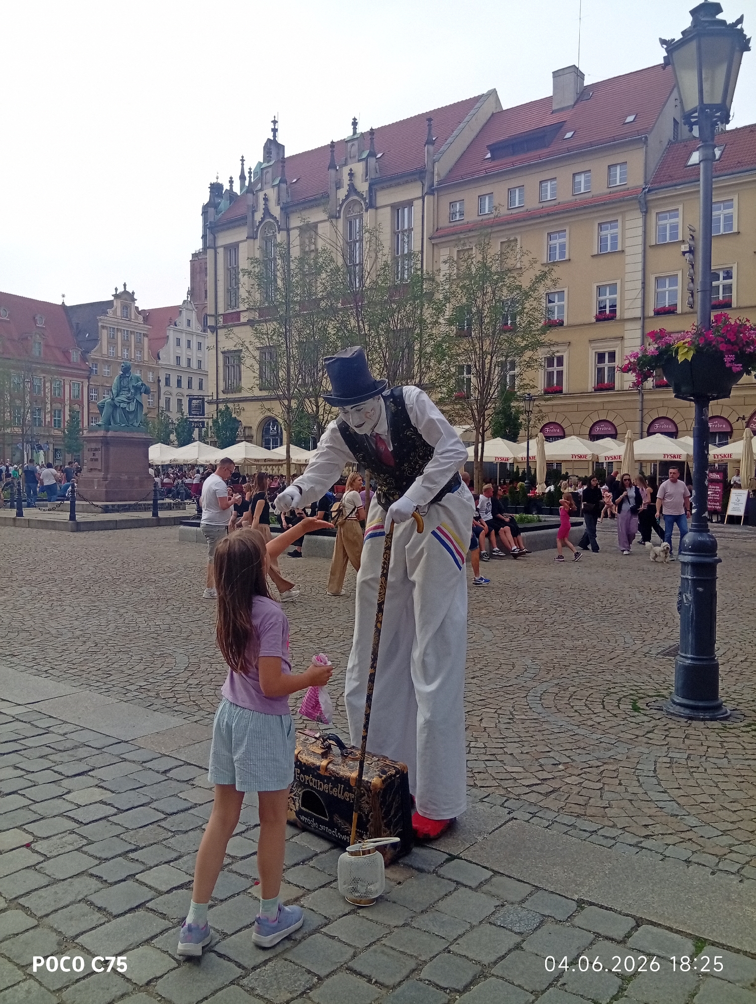 Street performers entertain crowds in Wrocław's historic Old Town Square