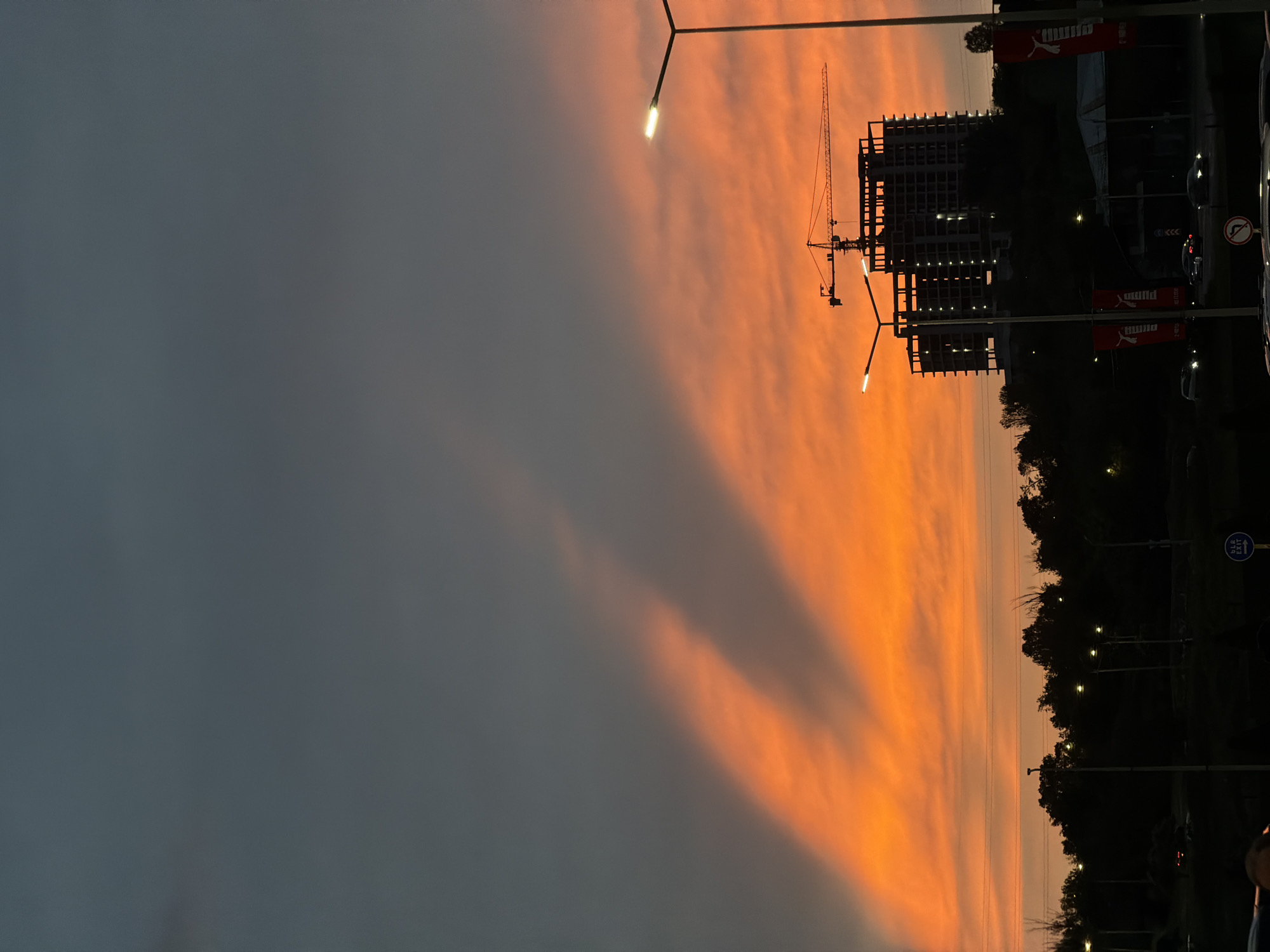 Sunset observed over Yerevan construction site amid cloudy skies