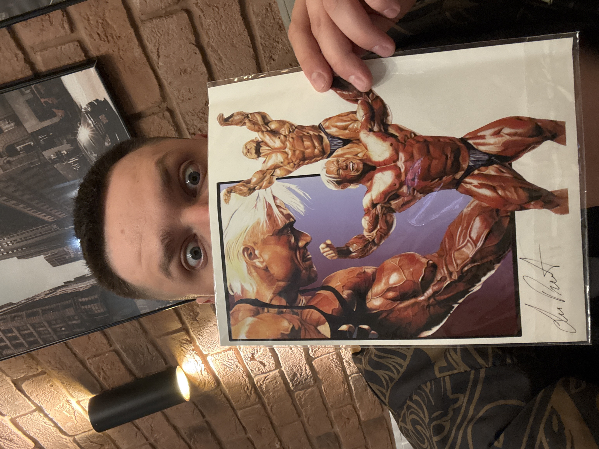 Man displays wrestling comic, workout graphics observed in Vladivostok