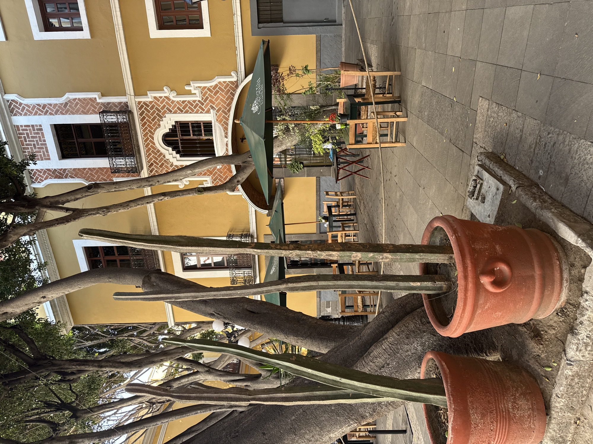 Evening street life documented around historic Puebla church