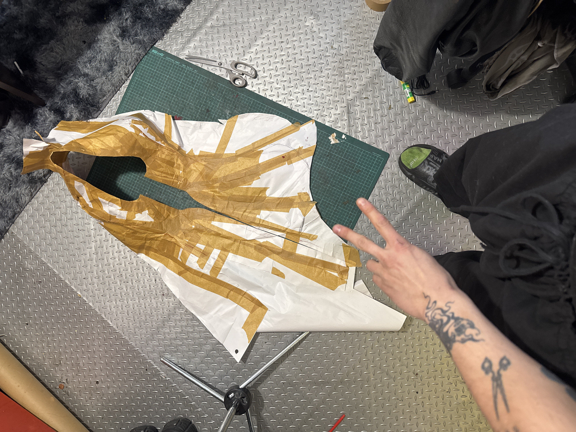 Crafting workspace with pattern and tape documented in Sofia