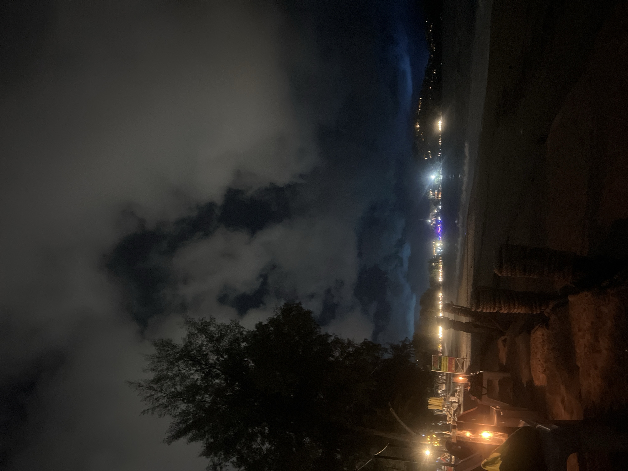 Nighttime coastal city scenes captured by multiple witnesses