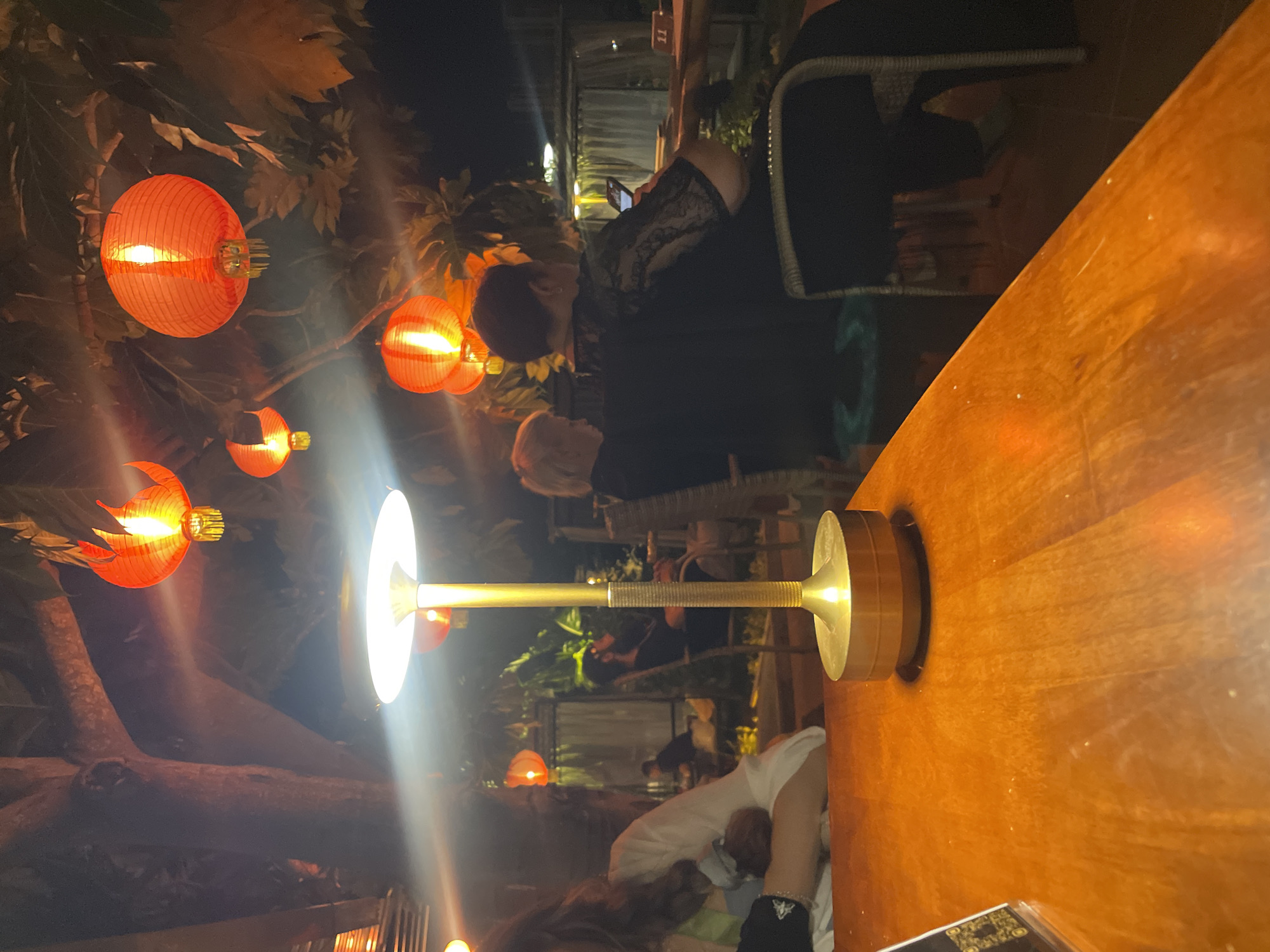 Evening gathering with lanterns and music at Vietnamese heritage site