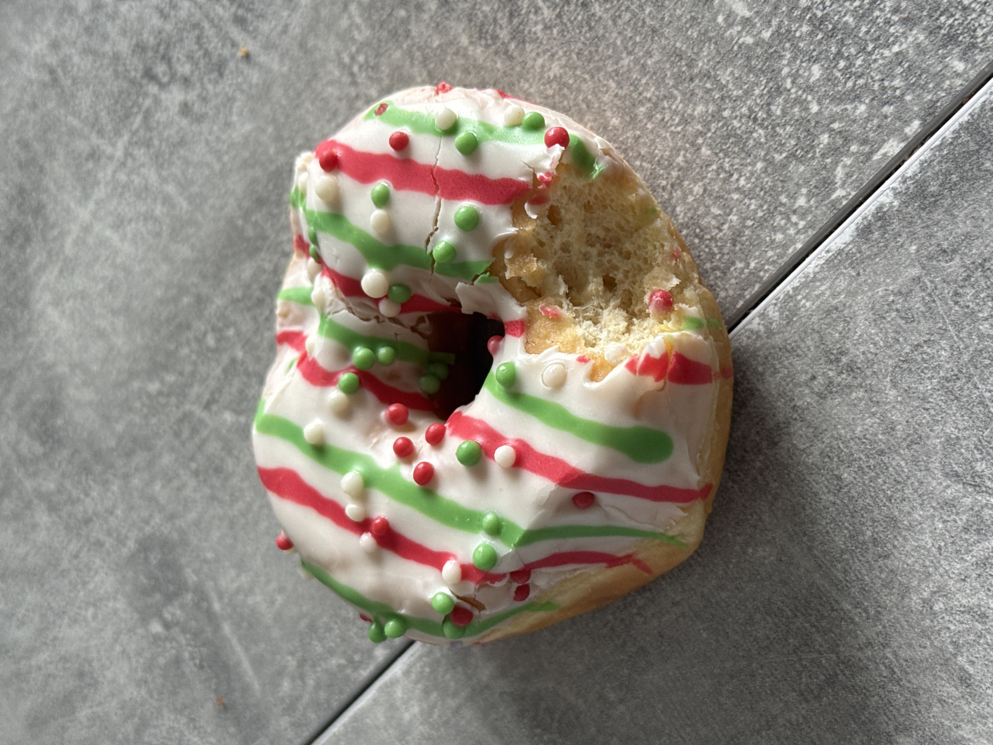 Decorated donut spotted on tiled surface in Lyubertsy