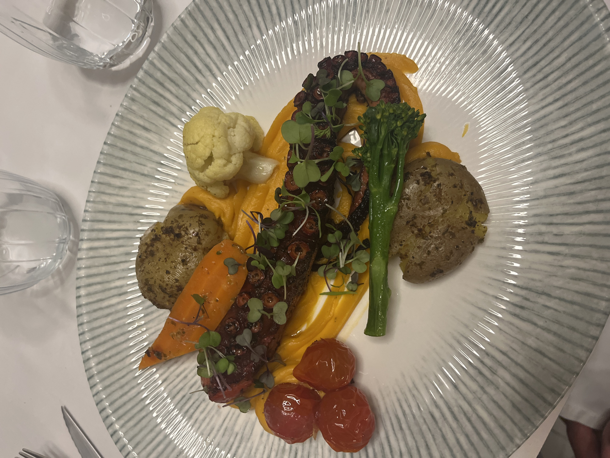 Evening dinner service captured in Spanish coastal community