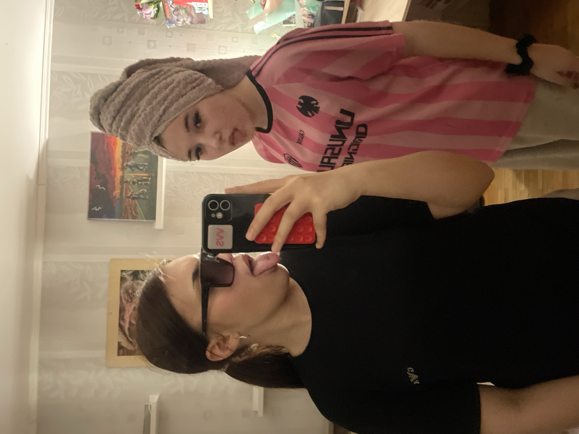 Two women take mirror selfie in Vsevolozhsk, Russia