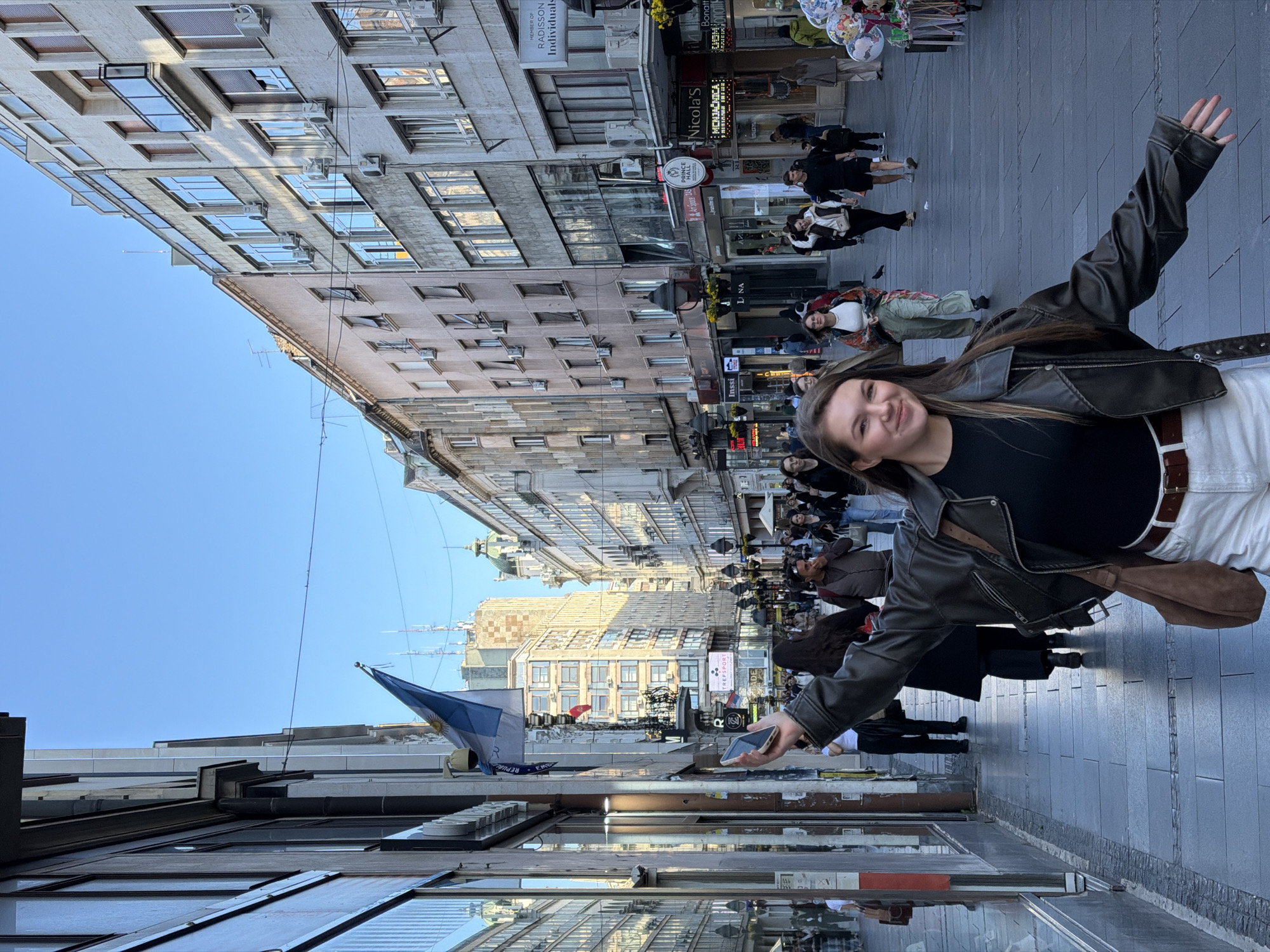 Woman poses on busy Belgrade pedestrian street Tuesday afternoon