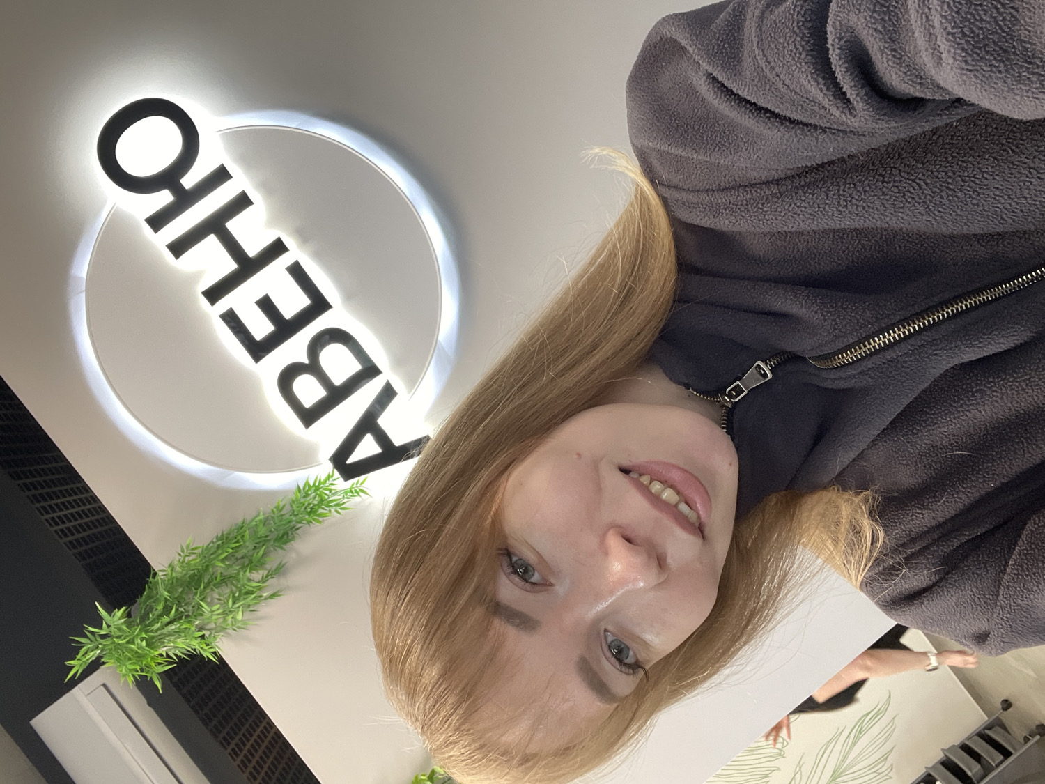 Woman takes selfies at hair salon in Perm, Russia