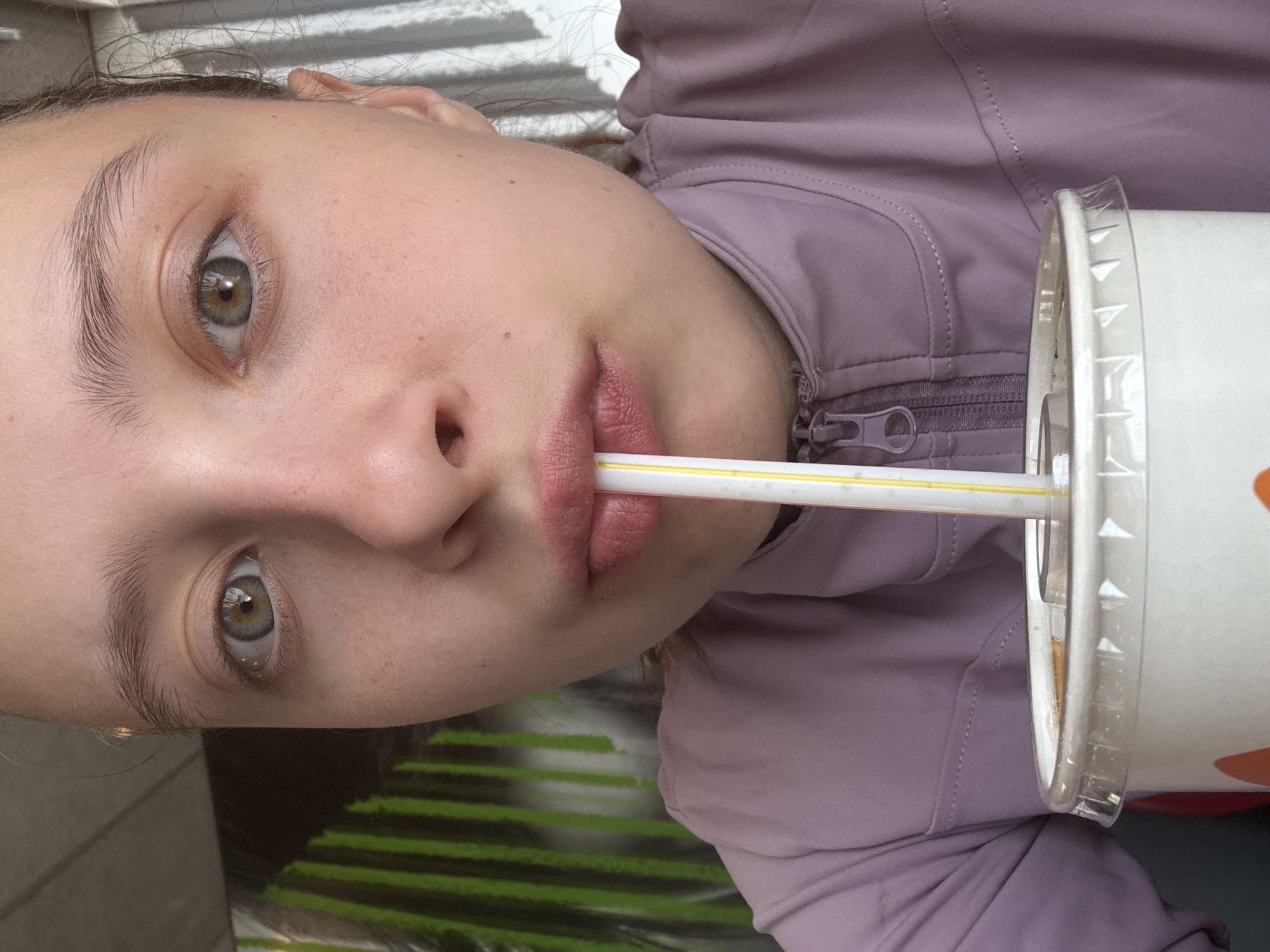 Young woman enjoys McDonald's meal in Perm, Russia