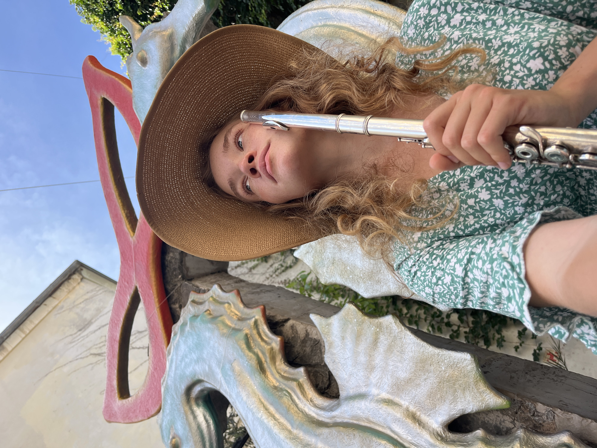Street musician plays flute in historic Budva alleyways