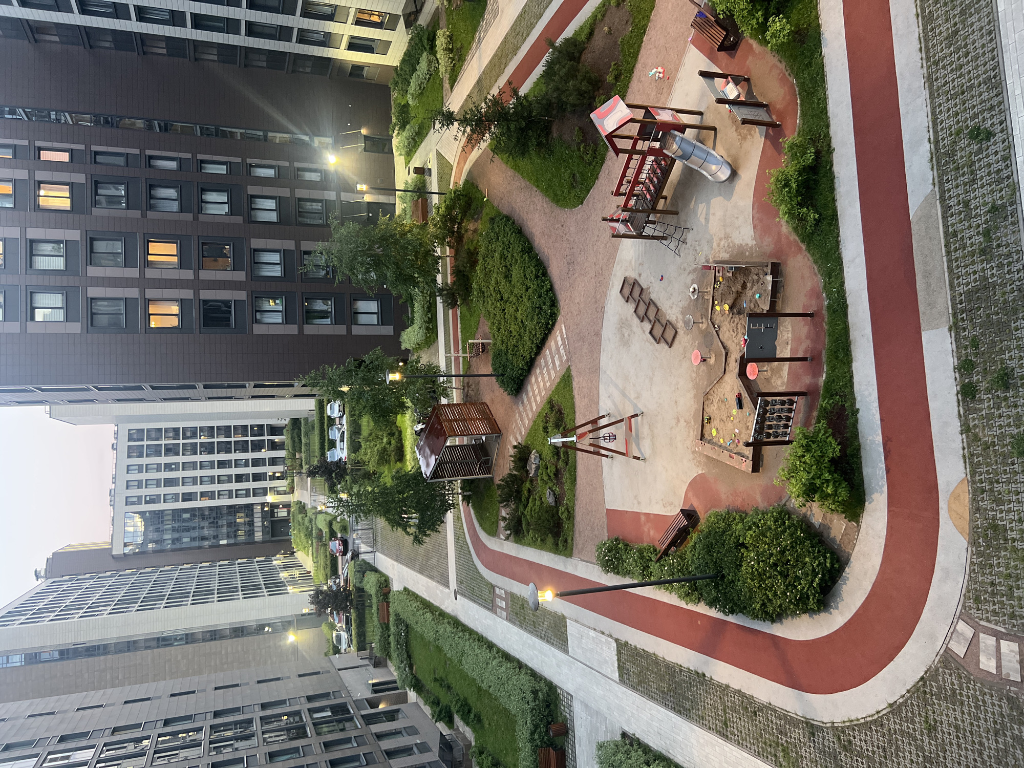 Modern apartment complex photographed at dusk from multiple perspectives