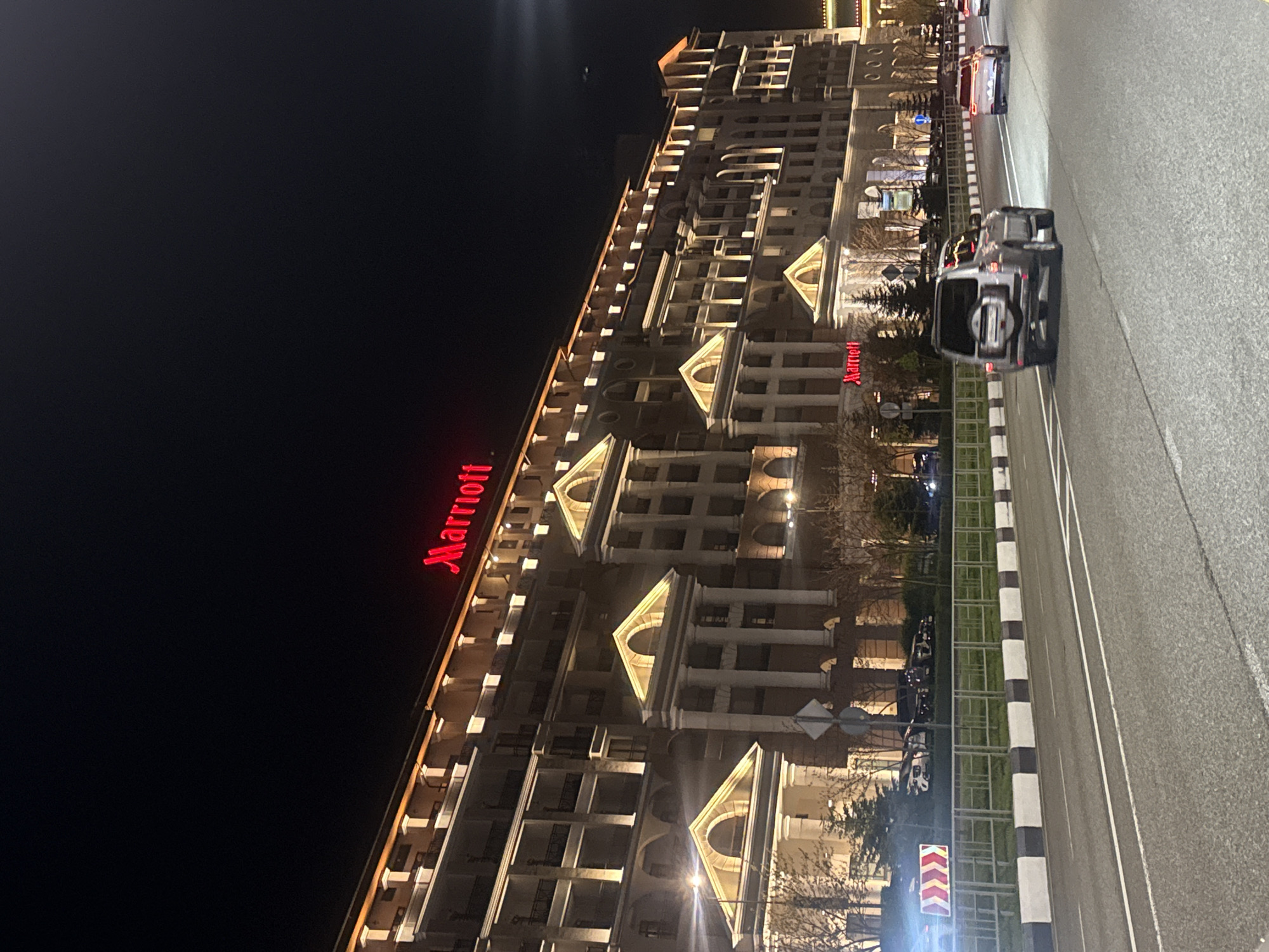 Ornate classical building photographed at night in Estosadok, Russia