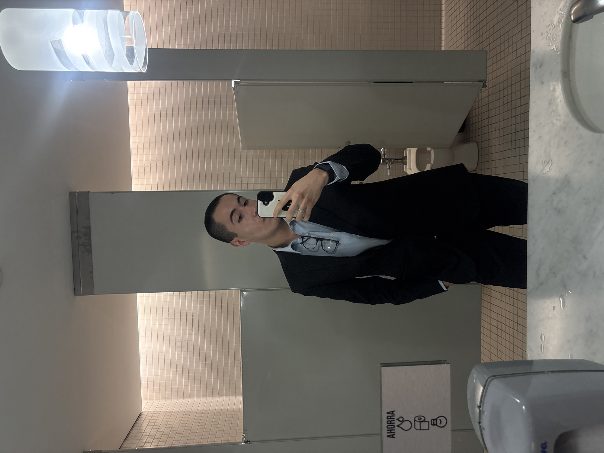 Person Takes Mirror Selfie in Mexico City Public Restroom