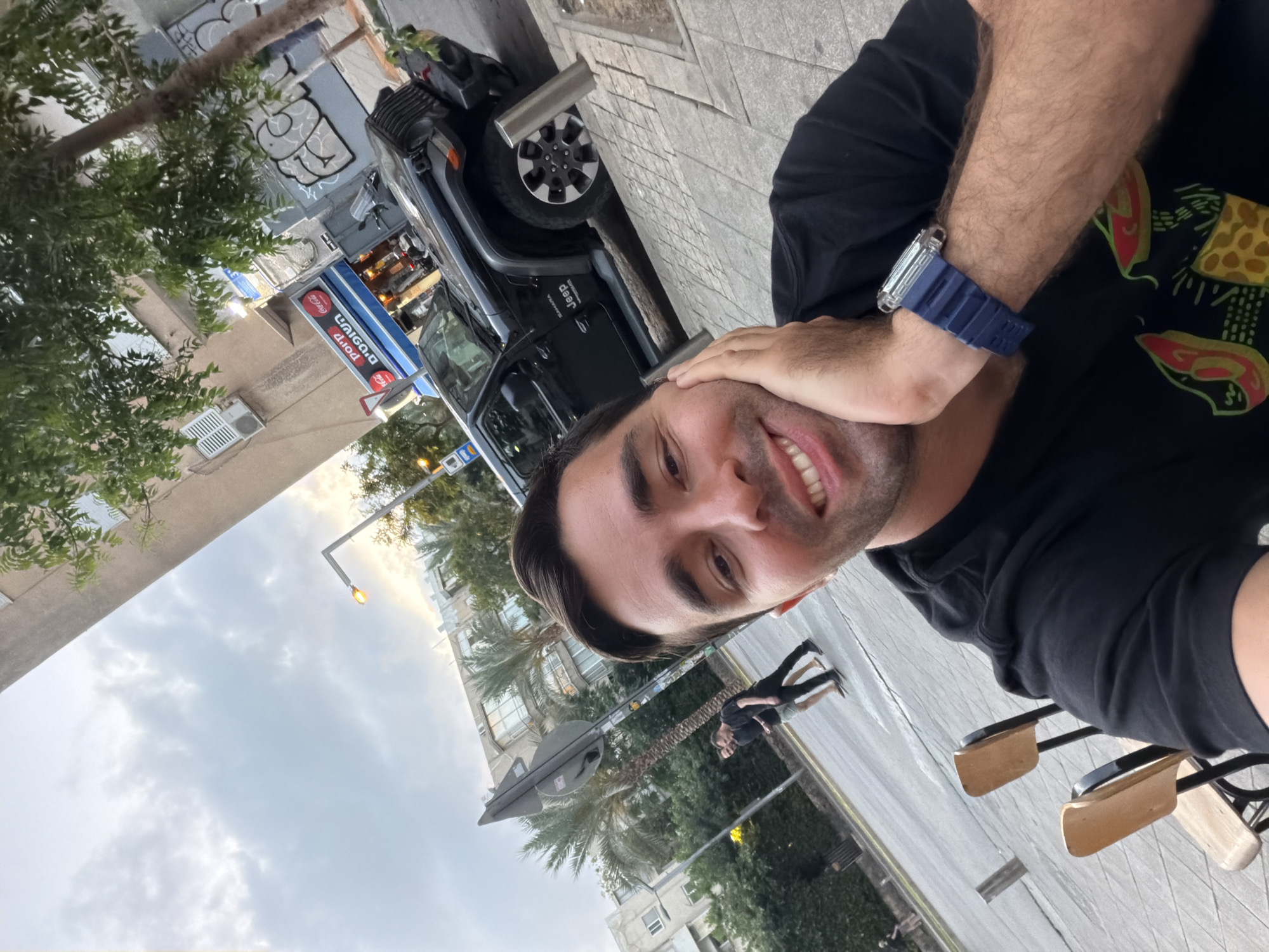 Man takes selfie with black Jeep in Tel-Aviv